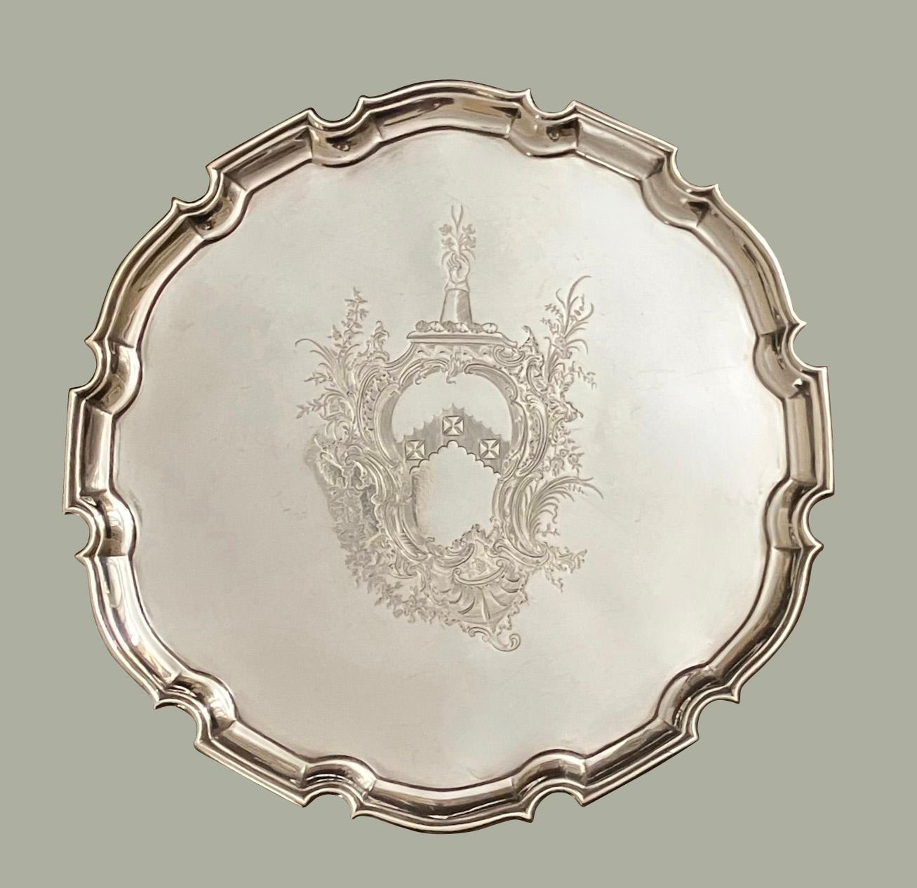 A good George II sterling silver salver of typical form with a pie crust edge, fully hallmarked for London 1734 and made by Edward Pocock. Weight 653 grams. The piece bears a finely engraved untraced contemporary armorial.
Salvers were typically