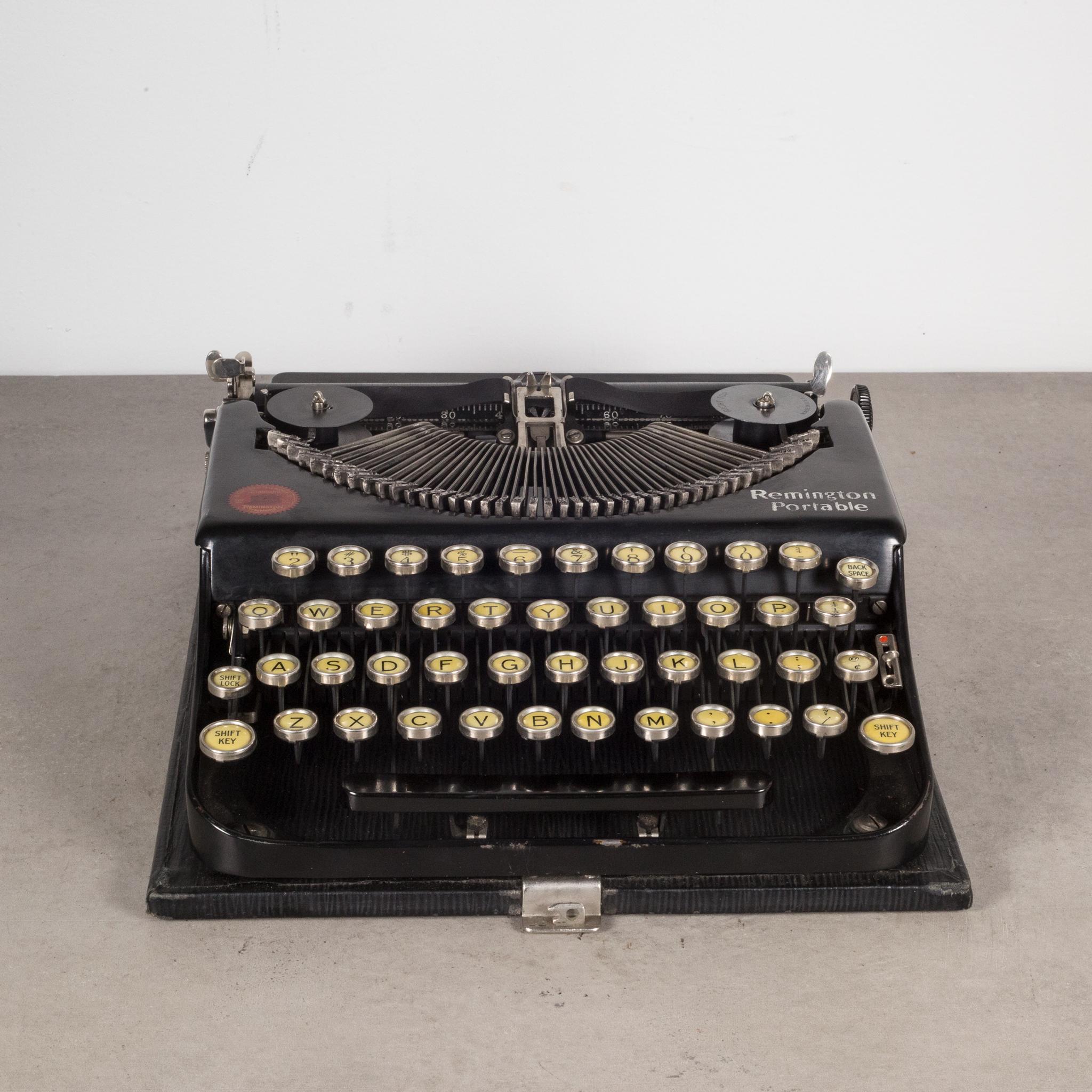 About

An original Remington Portable No. 1 Typewriter with original case. This typewriter features strikers that fold flat into the body and rise by turning a knob. The keys are nickle with black letters on a yellow background.  It has smooth