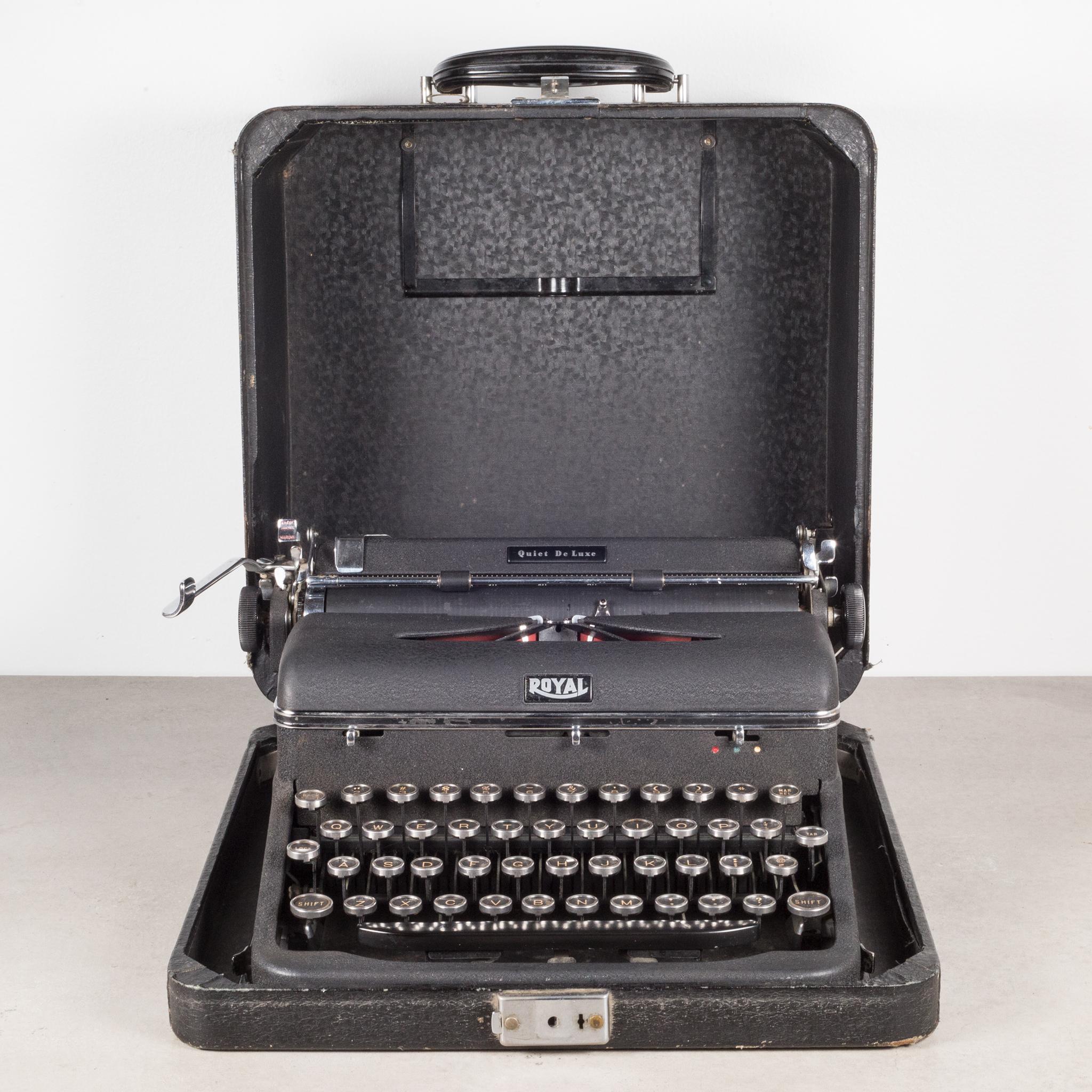 About

An antique fully refurbished and very clean Royal Quiet DeLuxe typewriter with black, crinkle finish and original case. The keys are nickel and glass with gold letters on black background. The case has a Bakelite handle. Serial number: