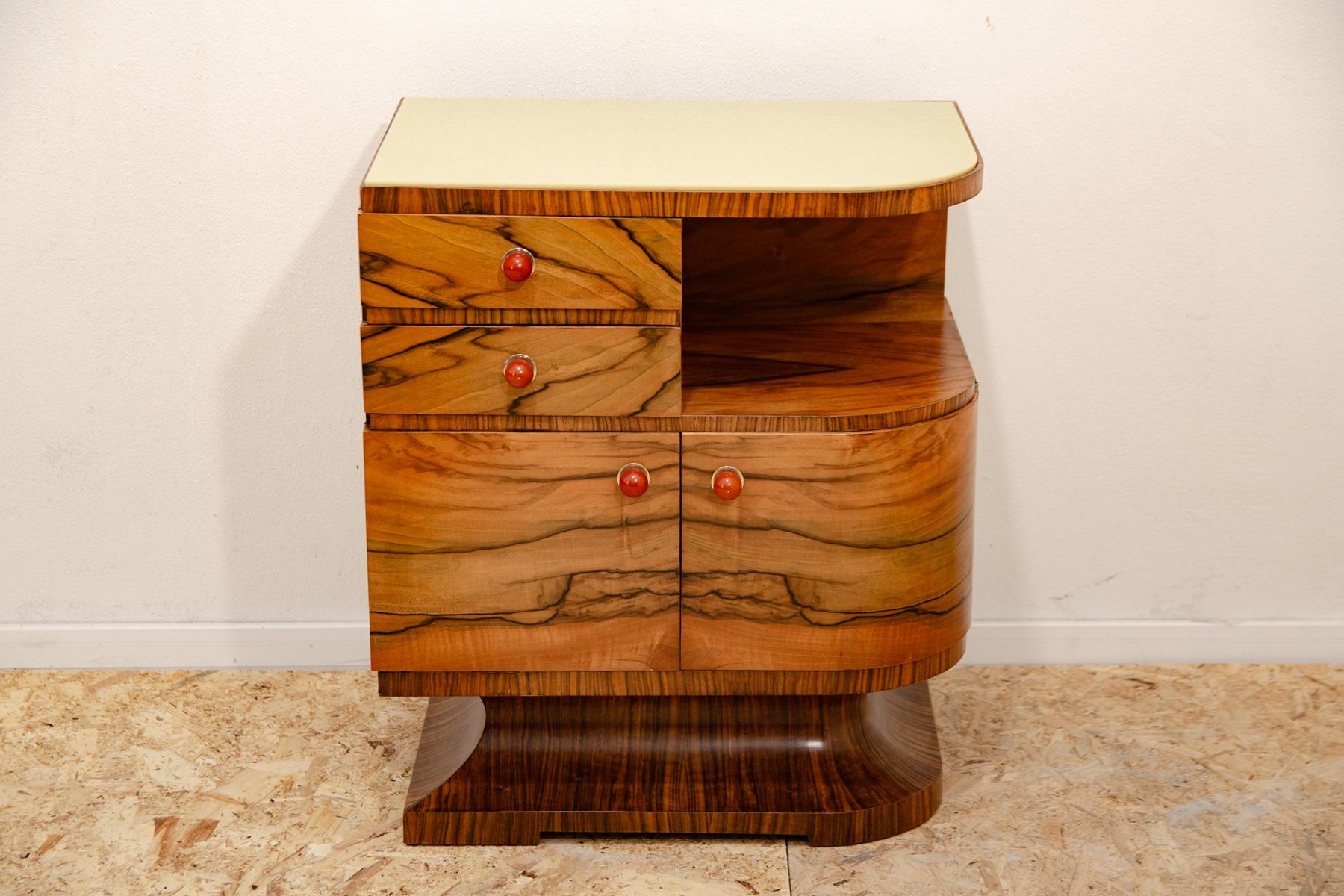 This beautiful piece of furniture was made in the former Czechoslovakia in the 1930´s. It´s made of walnut with glass on the top.

It was originally part of an ART DECO bedroom. Now it can be used as a bedside table or bar etc.

In excellent