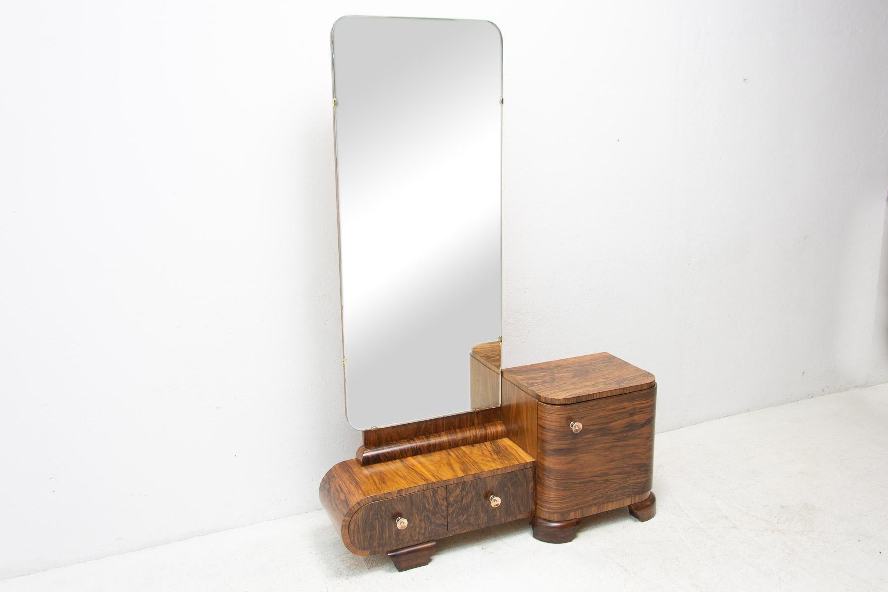 ART DECO Vanity/dressing table made in the former Czechoslovakia in the 1930’s. An outstanding timeless design. It´s made of walnut and glass. In excellent condition.

Measures: Height: 168 cm Width: 113 cm Depth: 37 cm.