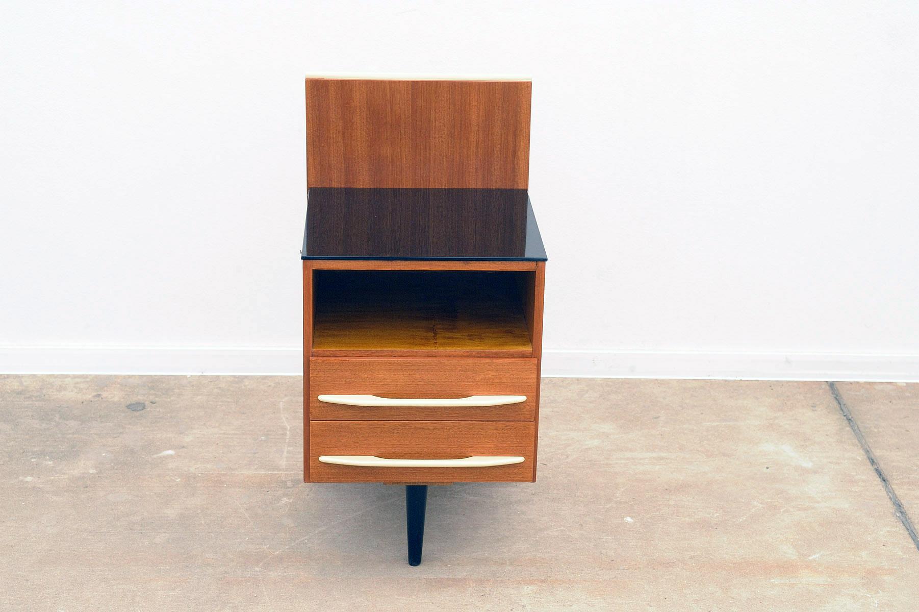 This nightstand/bedside table was designed by Mojmír Požár for UP Závody and made in the former Czechoslovakia in the 1960´s. Mahogany and beech wood.
In excellent condition, fully renovated.

Height: 81 cm

width: 42 cm

depth: 40 cm