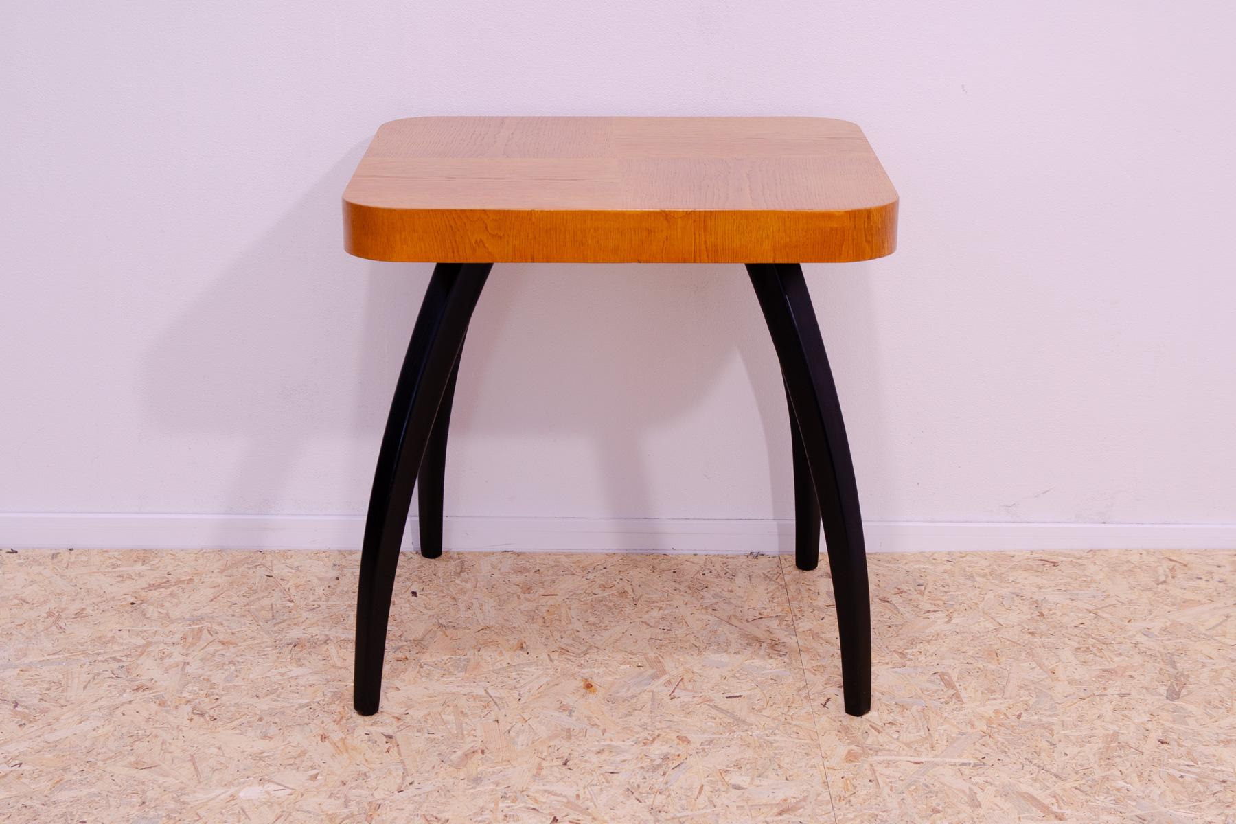 This square coffee table in the shape of spider was designed by Jindřich Halabala in the 1930´s.

It has a distinctive curved legs and rounded corners. It´s made of beech wood.

In excellent condition, fully renovated.

width 64 x height 64 x depth