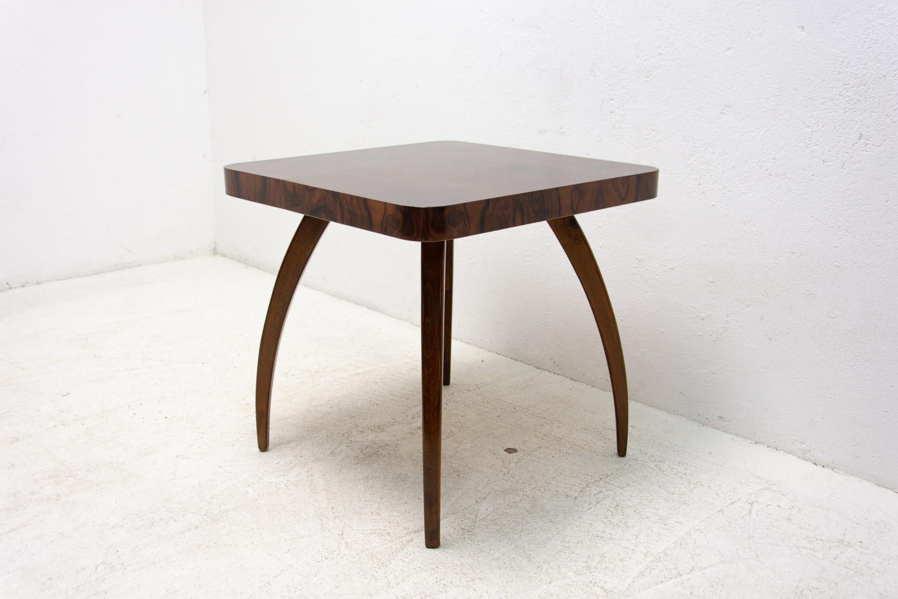 Square coffee table in the shape of spider designed by Jindrich Halabala, with distinctive curved legs, rounded corners. Walnut wood. Made in the former Czechoslovakia in the 1950´s.

Construction of the table in very good condition. In excellent