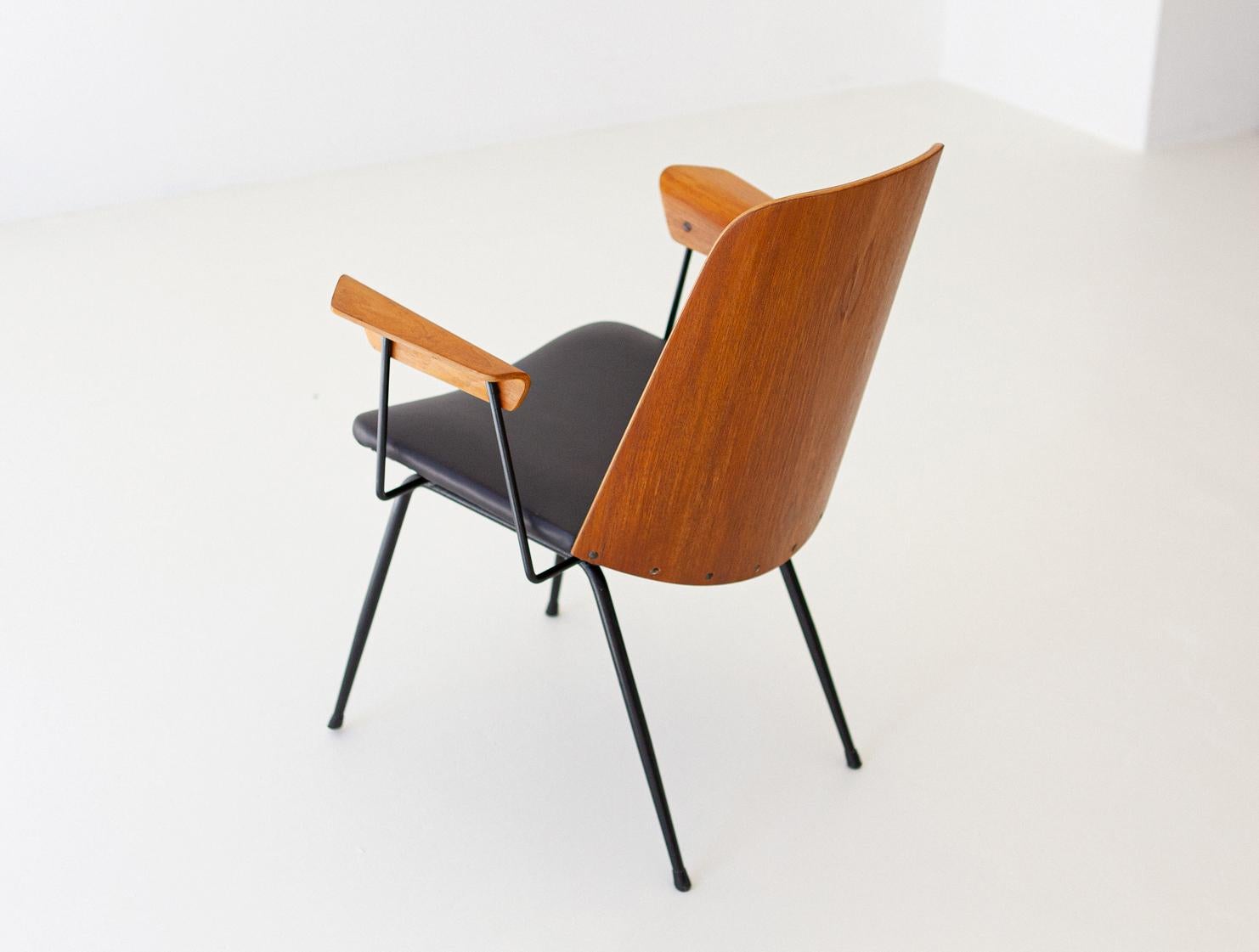 Modern easy chair  with armrests,
Model DU22 ,  designed by Gastone Rinaldi and produced by Rima during the 1950s.

Also usable as desk chair.

Completely restored:
New black natural leather and new padding 
New teak veneer on the curved backrests