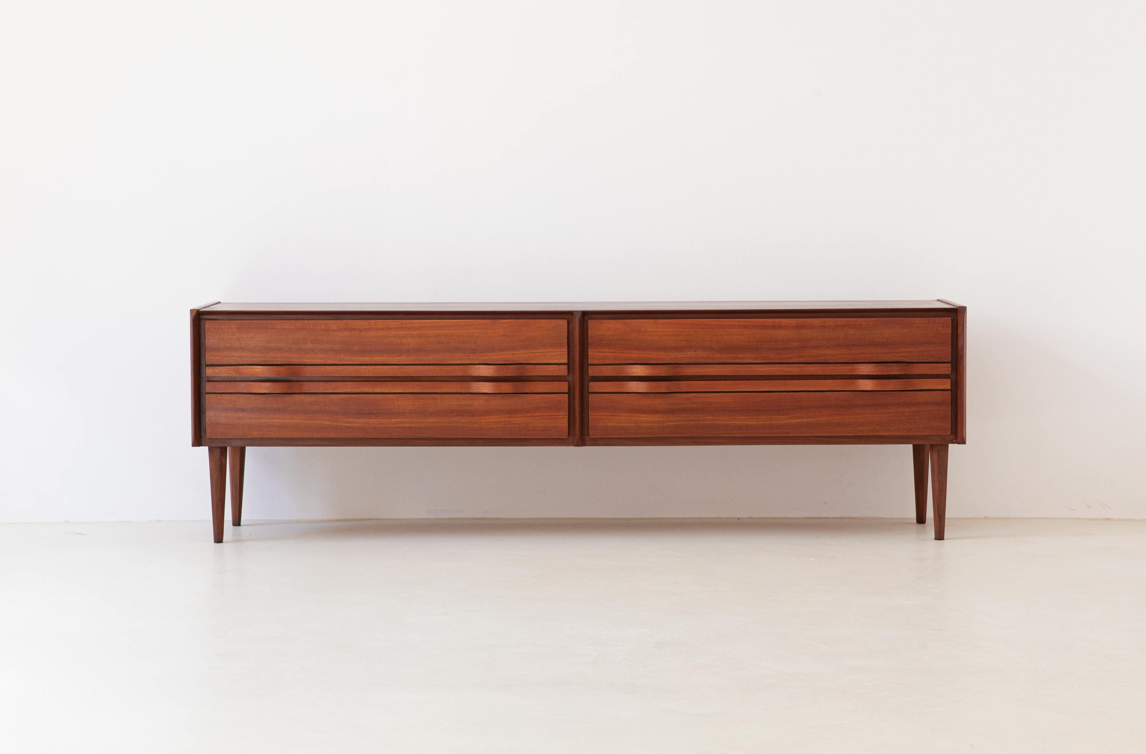 A modern sideboard with chest of drawers manufactured in Italy during the 1950s

This credenza has 4 drawers with handles made from teak bentwood
We have made a full restoration on this piece:
The original finish has been completely removed to