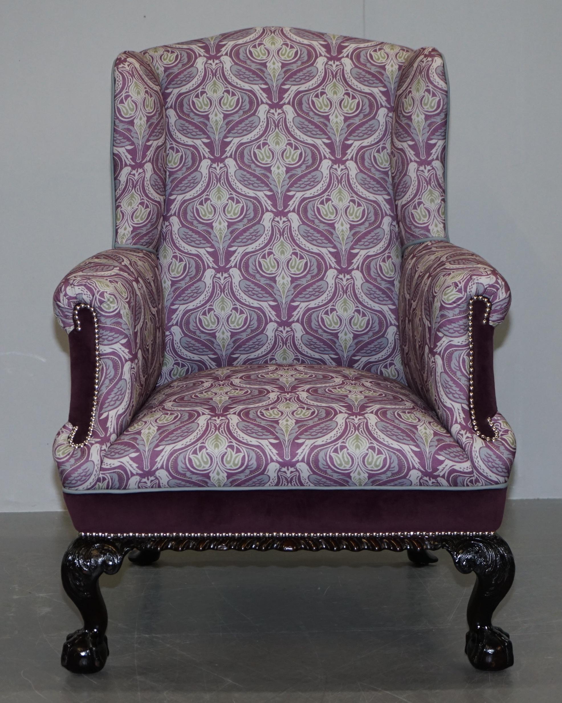 We are delighted to offer for sale this lovely fully restored Victorian wingback armchair with ornately carved frame and claw and ball feet

A very nicely restored piece, the chair has been stripped back and reupholstered with luxury purple velvet