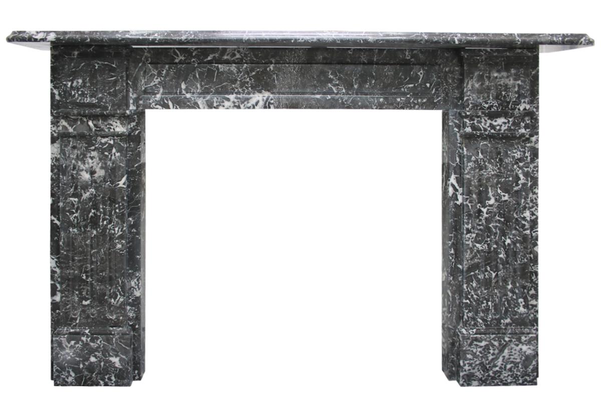 An imposing fully restored antique late Victorian St Anne marble fire surround with fluted capitals, the deep wide legs are also carved with flutes & reeds. Circa 1880. 

Pictured with an original cast iron and tiled insert, sold separately.

