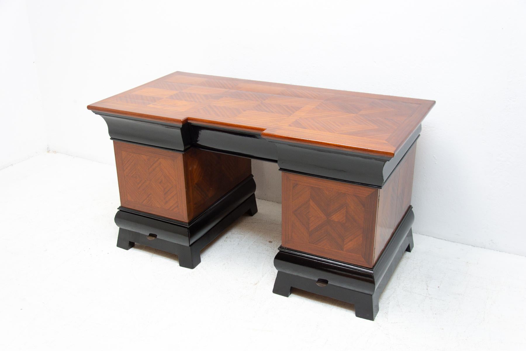 This Art Deco writing desk was made in the former Czechoslovakia in the 1930´s. It is made of beech wood and mahogany. The table has several �“secret boxes”. It is in very good condition, fully renovated.
 
