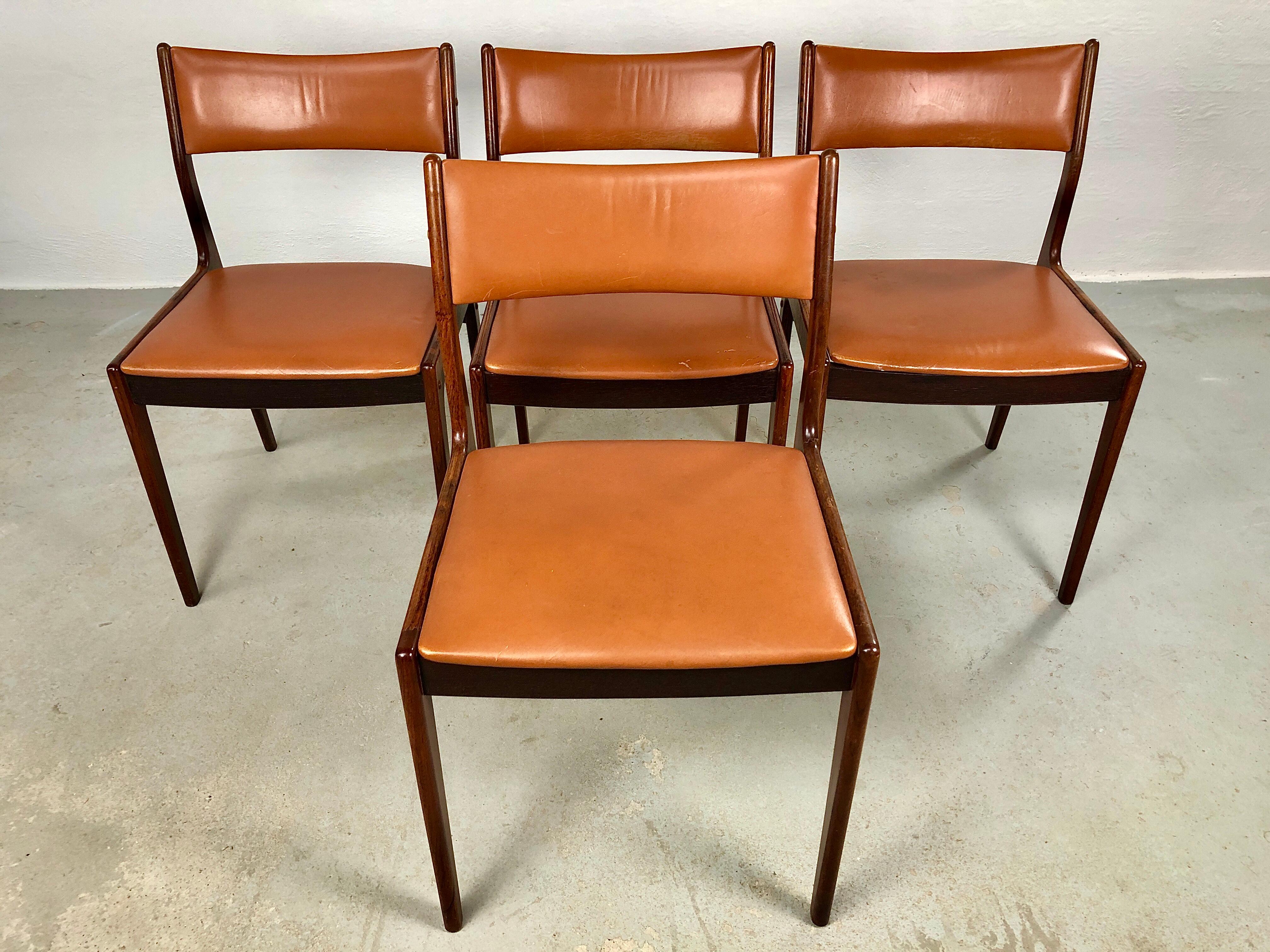 Set of 4 fully restored Danish Johannes Andersen rosewood dining chairs custom upholstey included.

The chairs with their simple yet light and elegant Johannes Andersen design have been fully restored by our skilled in house cabinetmakers - all