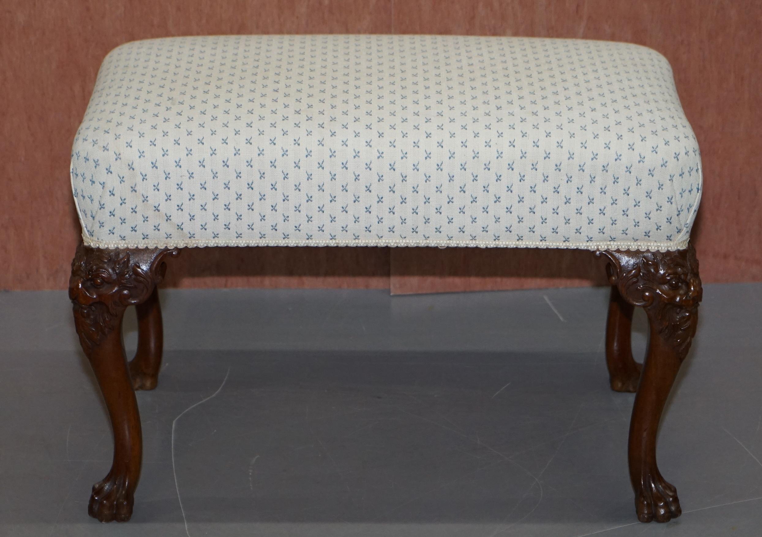 We are delighted to offer for sale this fully restored absolutely sublime George III style vintage hand carved mahogany bench stool

A very well presented hand carved stool, each leg starts at the top with a lions main then flows downwards with