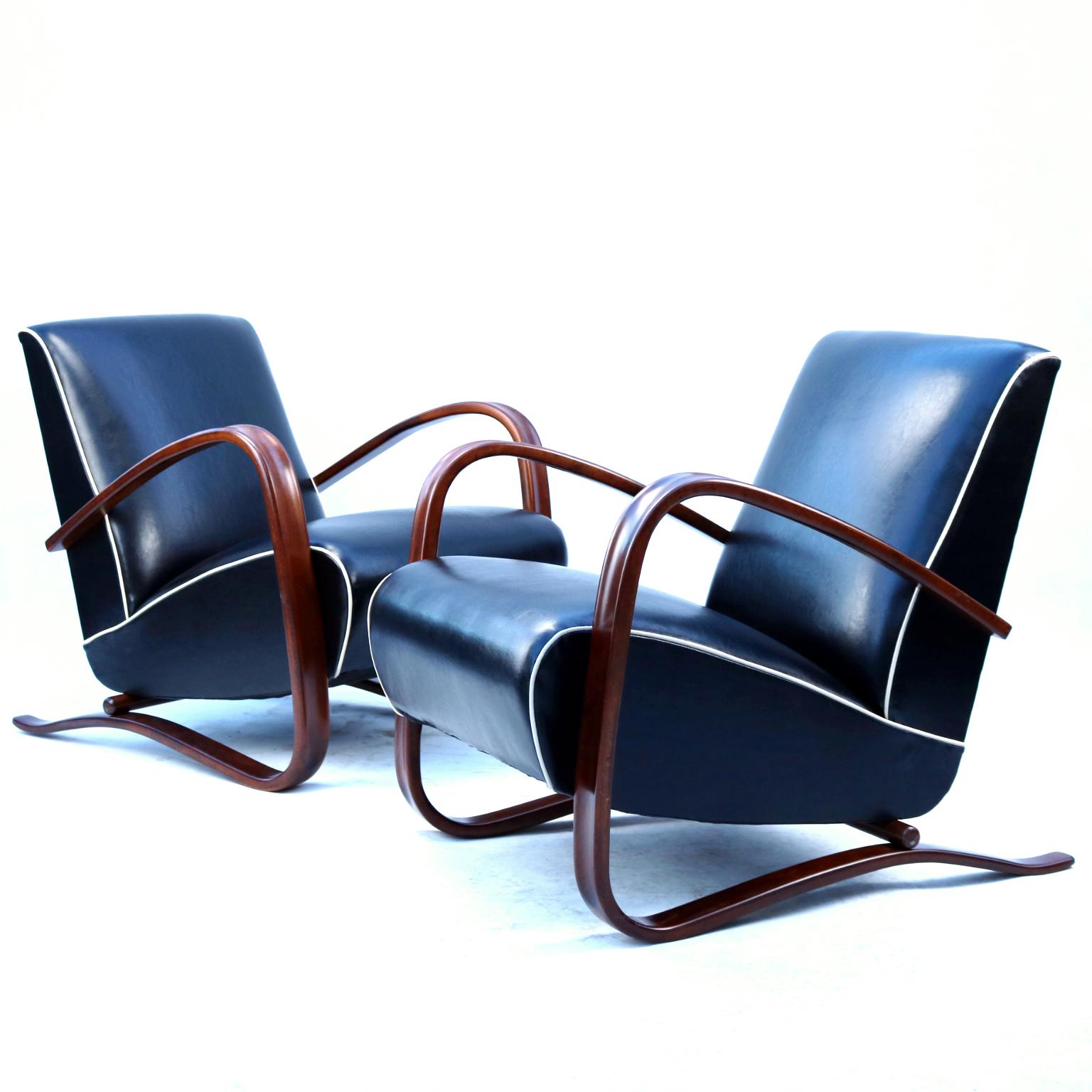 Fully restored pair of iconic H-269 lounge chairs designed by Jjindrich Halabala for UP Závody Brno in black 2mm thick cow leather, with white stripes.
Price for one piece.
Only one piece available.

In case of interest in two pices feel free to