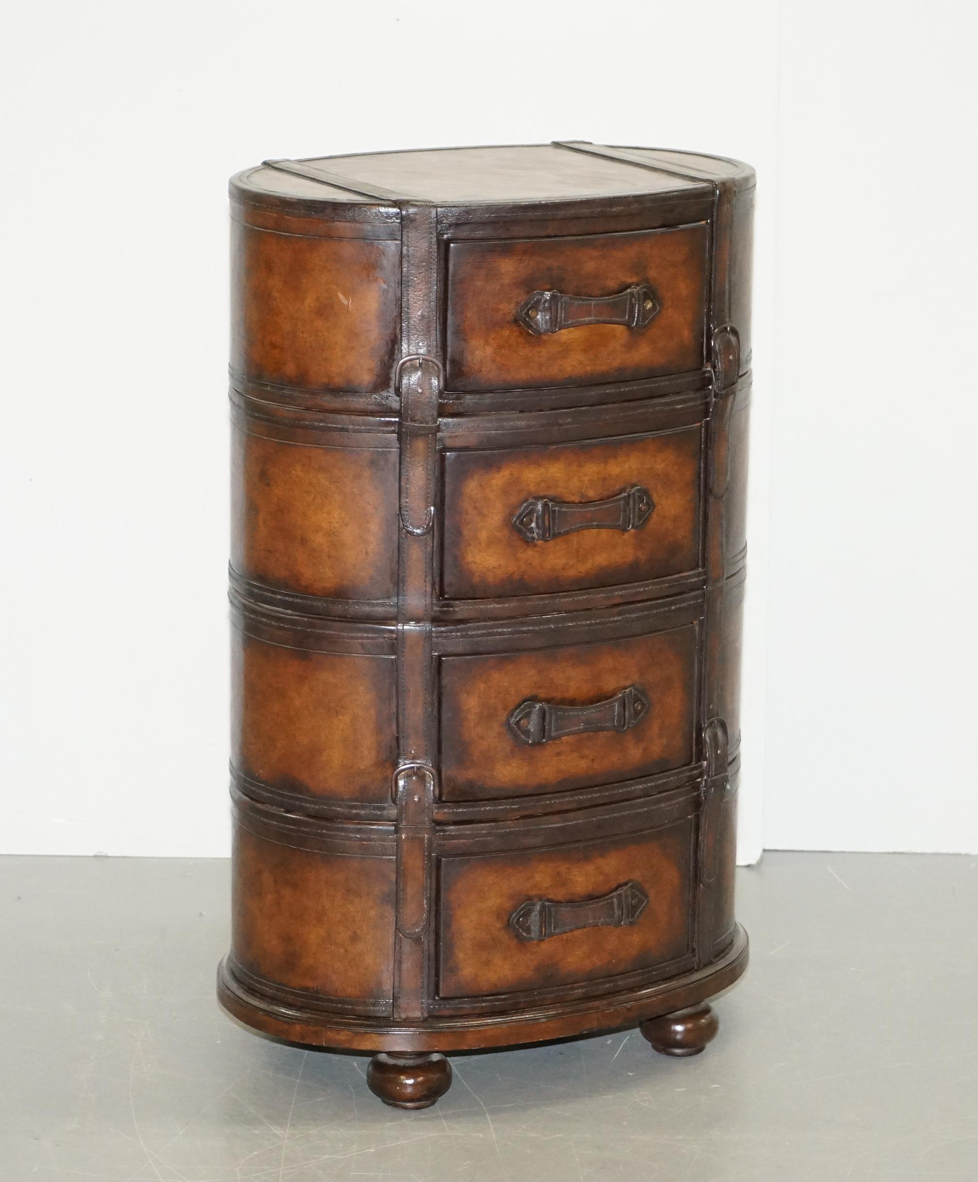 We are delighted to this lovely fully restored age hand dyed brown leather luggage tallboy chest of drawers

This is a very good looking and well-made chest of drawers, upholstered with thick leather all-over which has been hand dyed this rich