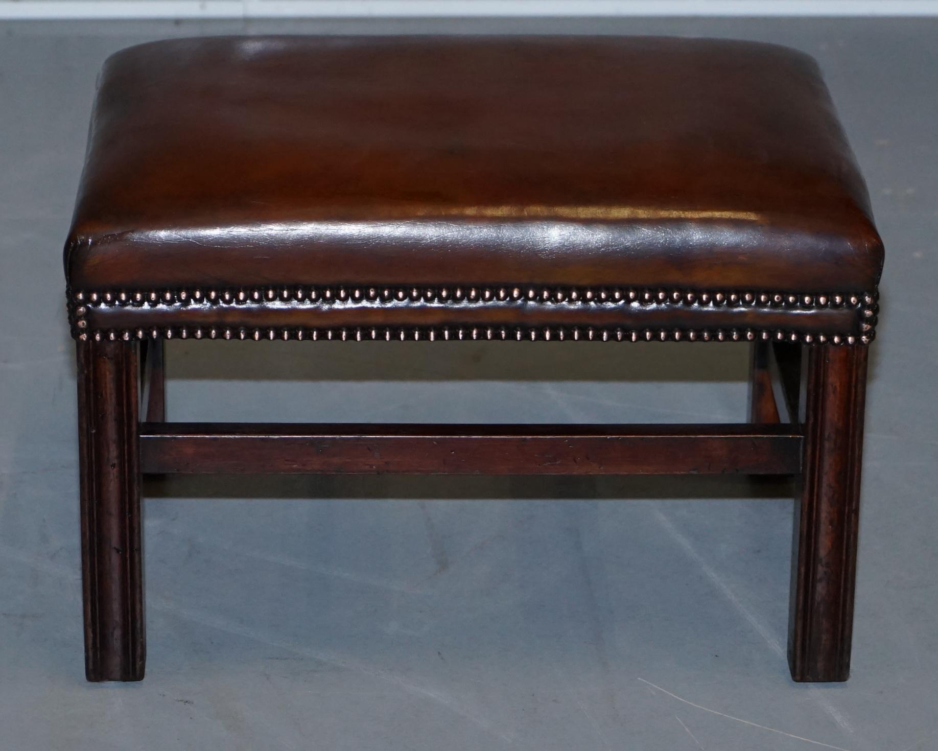 We are delighted to this absolutely stunning fully restored cigar brown leather footstool

A good looking and well-made piece, it has been fully restored to include being stripped back, hand dyed, antiqued, hand dyed again and then sealed, the