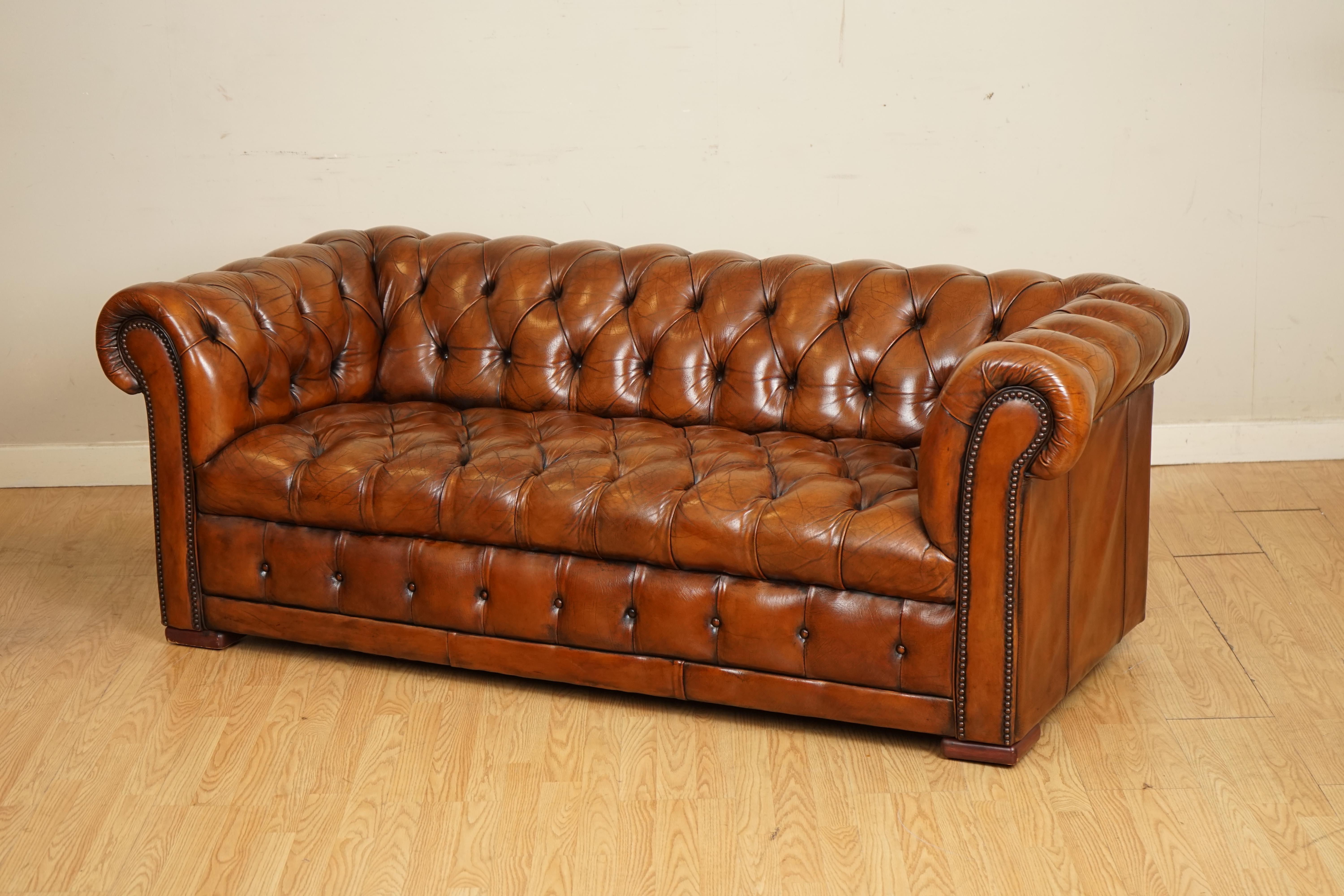 We are so excited to present to you this gorgeous fully buttoned restored whiskey brown hand dyed leather sofa.

A very well made victorian sofa that has been brought back to life by getting it stripped back from its original colour and hand dyed