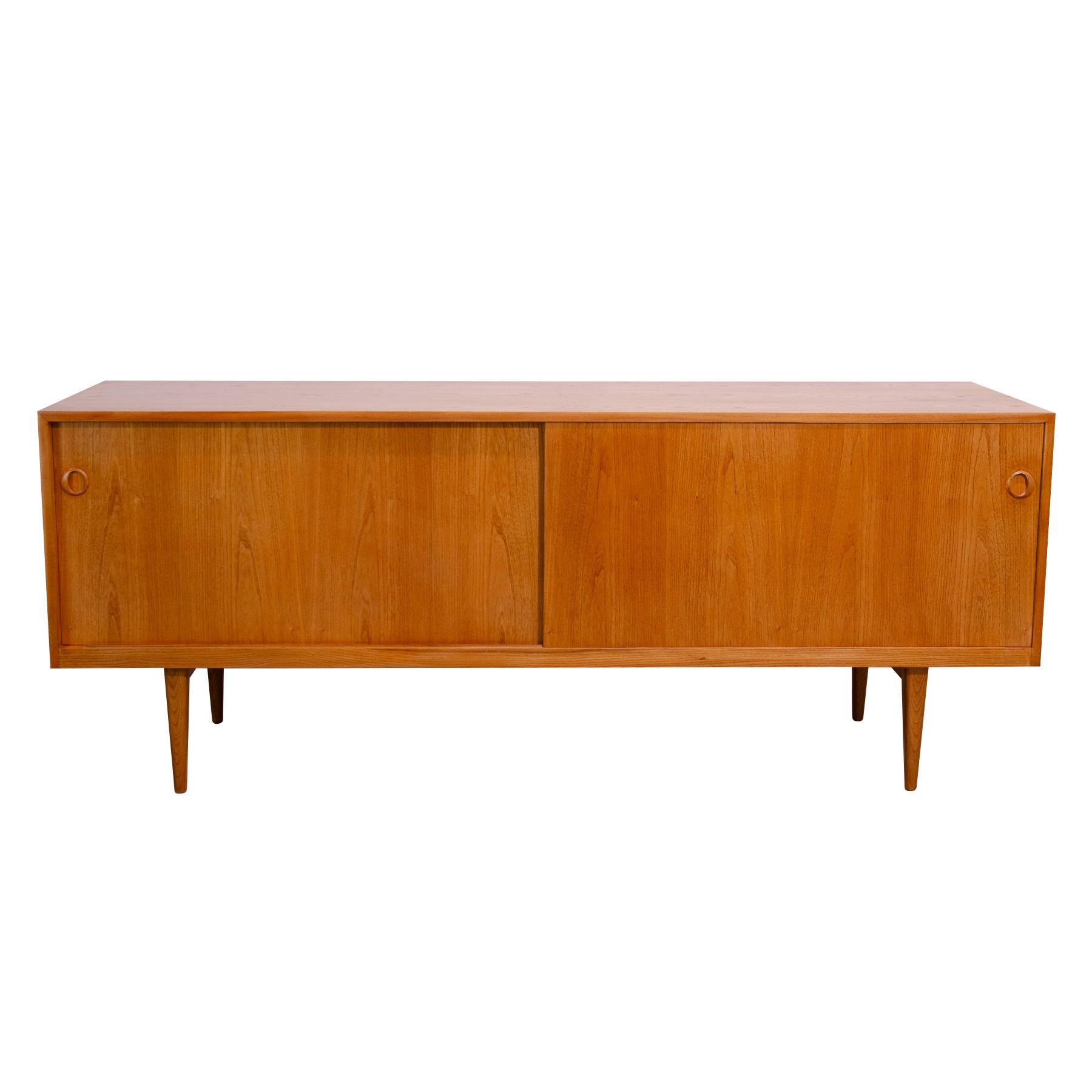 Mid century sideboard from the 1960´s. This sideboard is unique in that it has a two-sided opening.

This furniture were designed by Karel Vyčítal and Miloš Sedláček for Dřevotvar Jablonné nad Orlicí in the former Czechoslovakia. Miloš Sedláček and