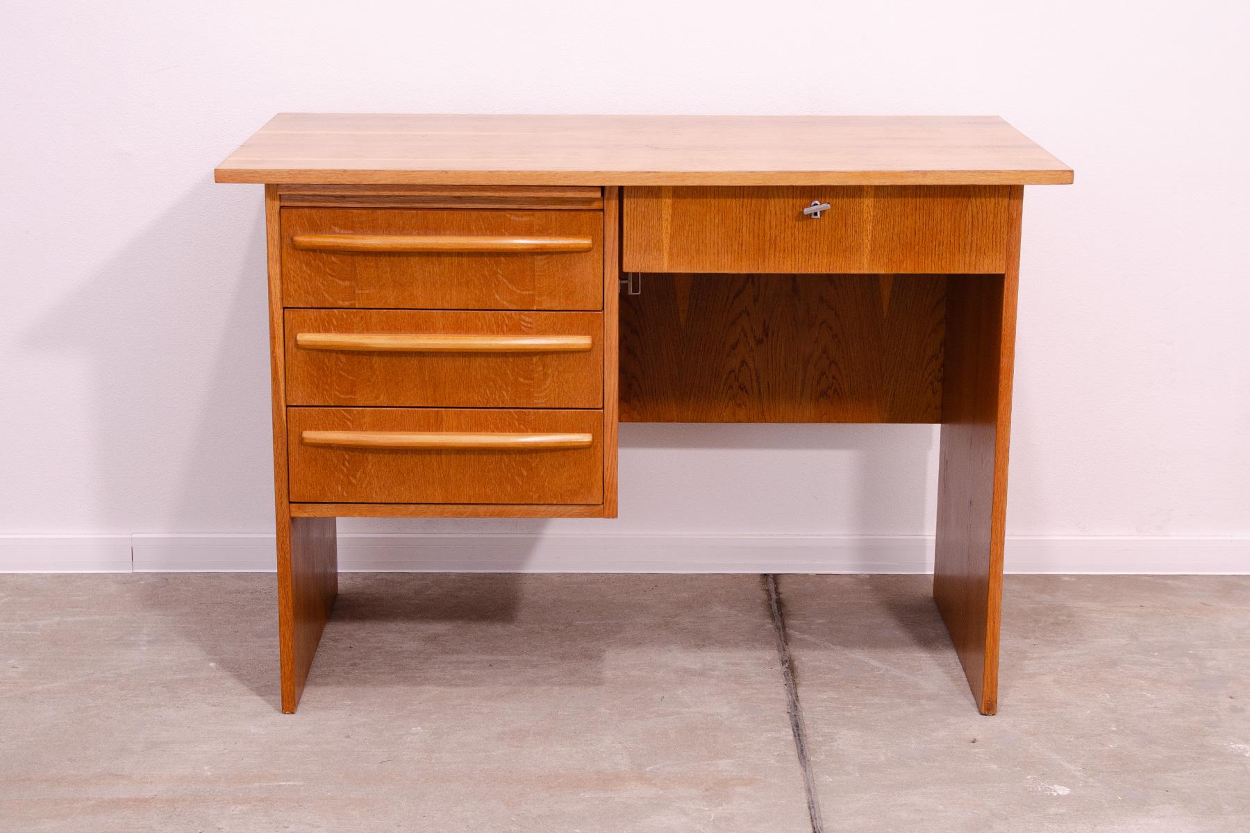 This writing desk was made in the former Czechoslovakia in the 1970´s.

It´s made of beech wood with plastic interiors of the drawers.

Very simple design.  In excellent condition, completely renovated.

Dimensions:

Length: 110 cm, Height: 77 cm,