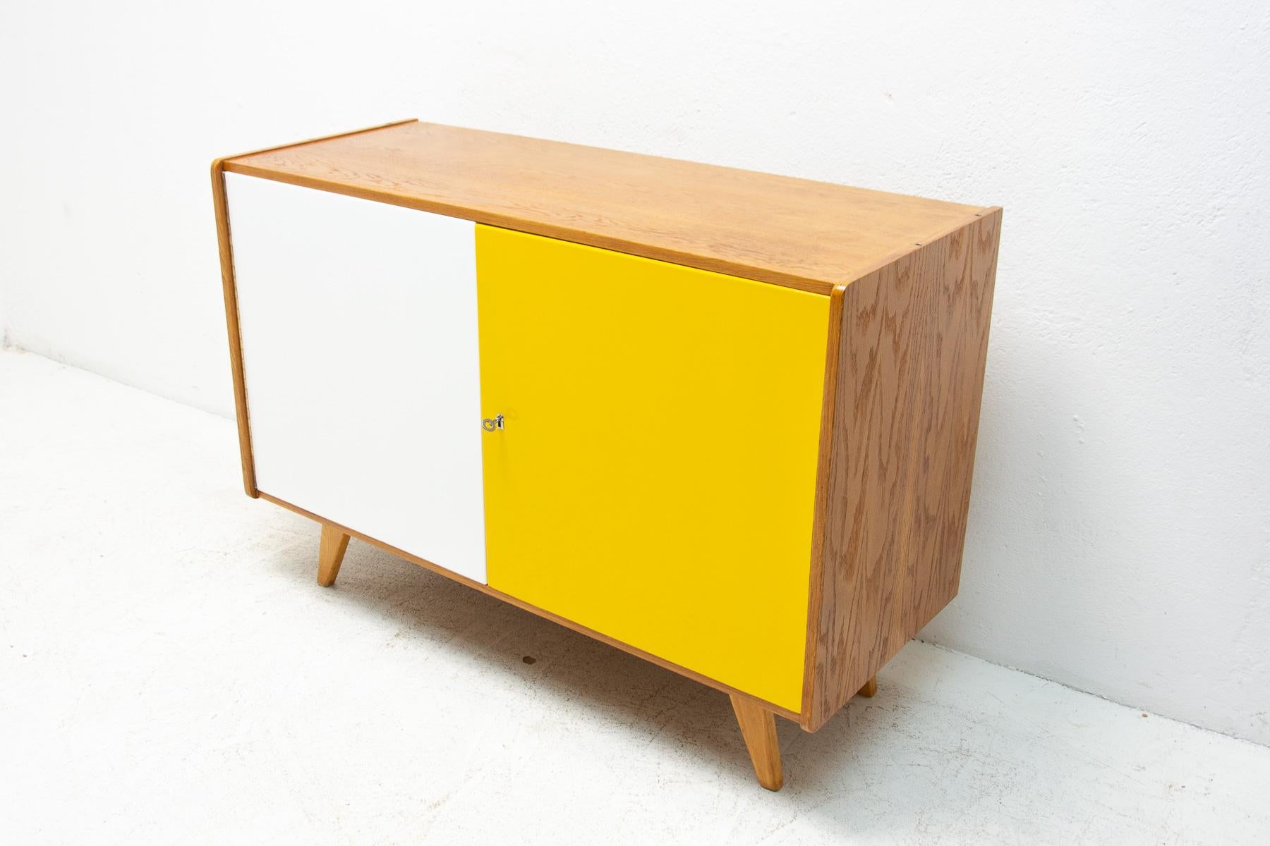 Mid century sideboard-cabinet, catalogue No. U-450, designed by Jiri Jiroutek. It´s made of beechwood, veneer, plywood and laminate. In excellent condition, fully refurbished.

The cabinet comes from the famous Universal series (U-450), which was
