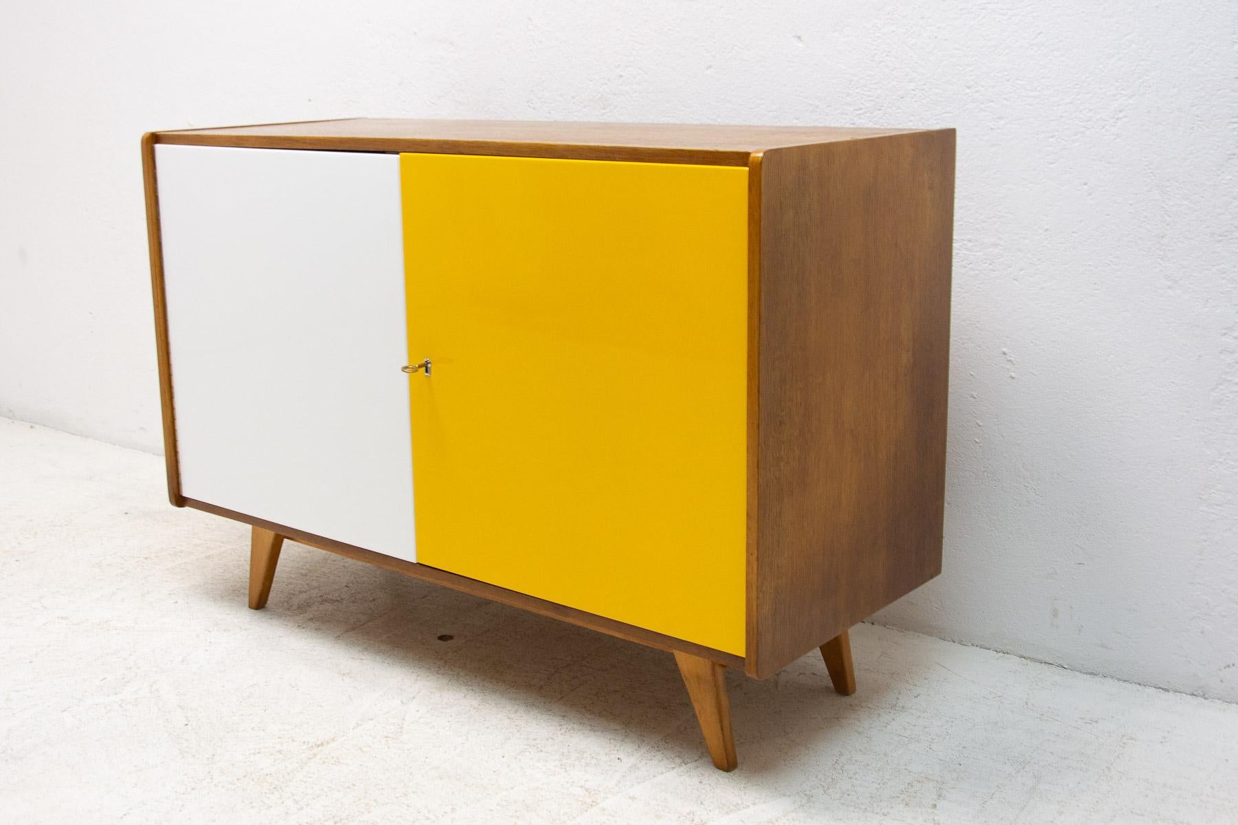 Mid century sideboard-cabinet, catalogue No. U-450, designed by Jiri Jiroutek. It´s made of beechwood, veneer, plywood and laminate. In very good condition.

The cabinet comes from the famous Universal series (U-450), which was designed in 1958