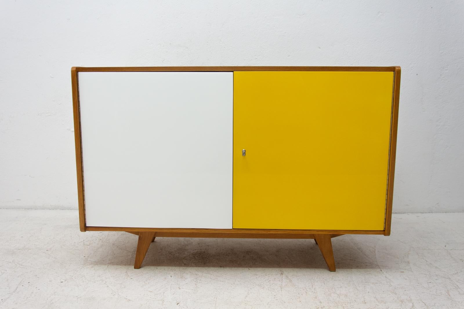 Midcentury sideboard-cabinet, catalogue no. U-450, designed by Jiri Jiroutek. It´s made of beechwood, veneer, plywood and laminate. In excellent condition, fully refurbished.

The cabinet comes from the famous Universal series (U-450), which was