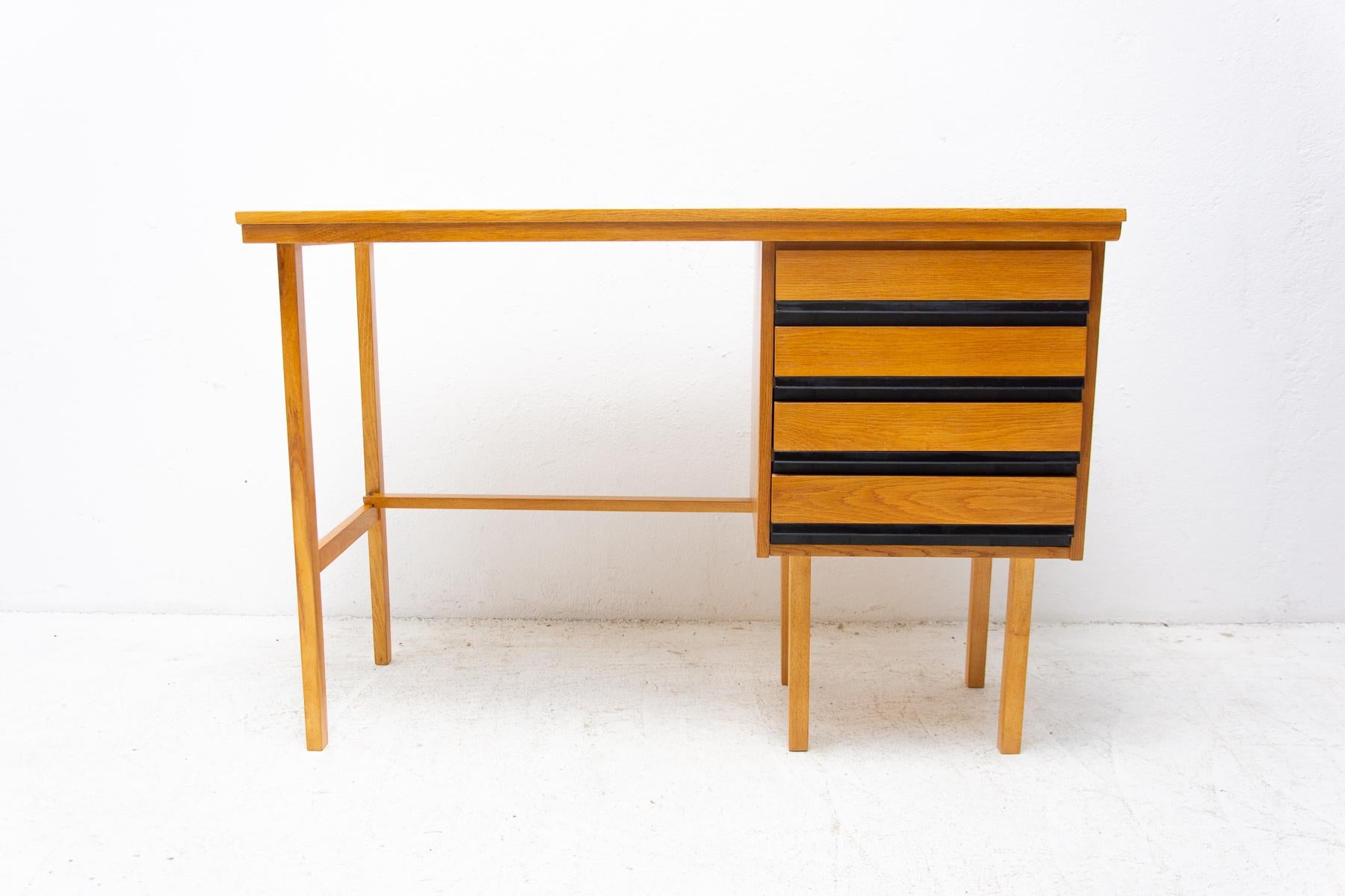 Mid century beech wood writing desk, 1960´s, Czechoslovakia
The design is very simple and elegant. It features a section with 4 plastic drawers. The surface of this desk has been fully restored and is in very good condition.