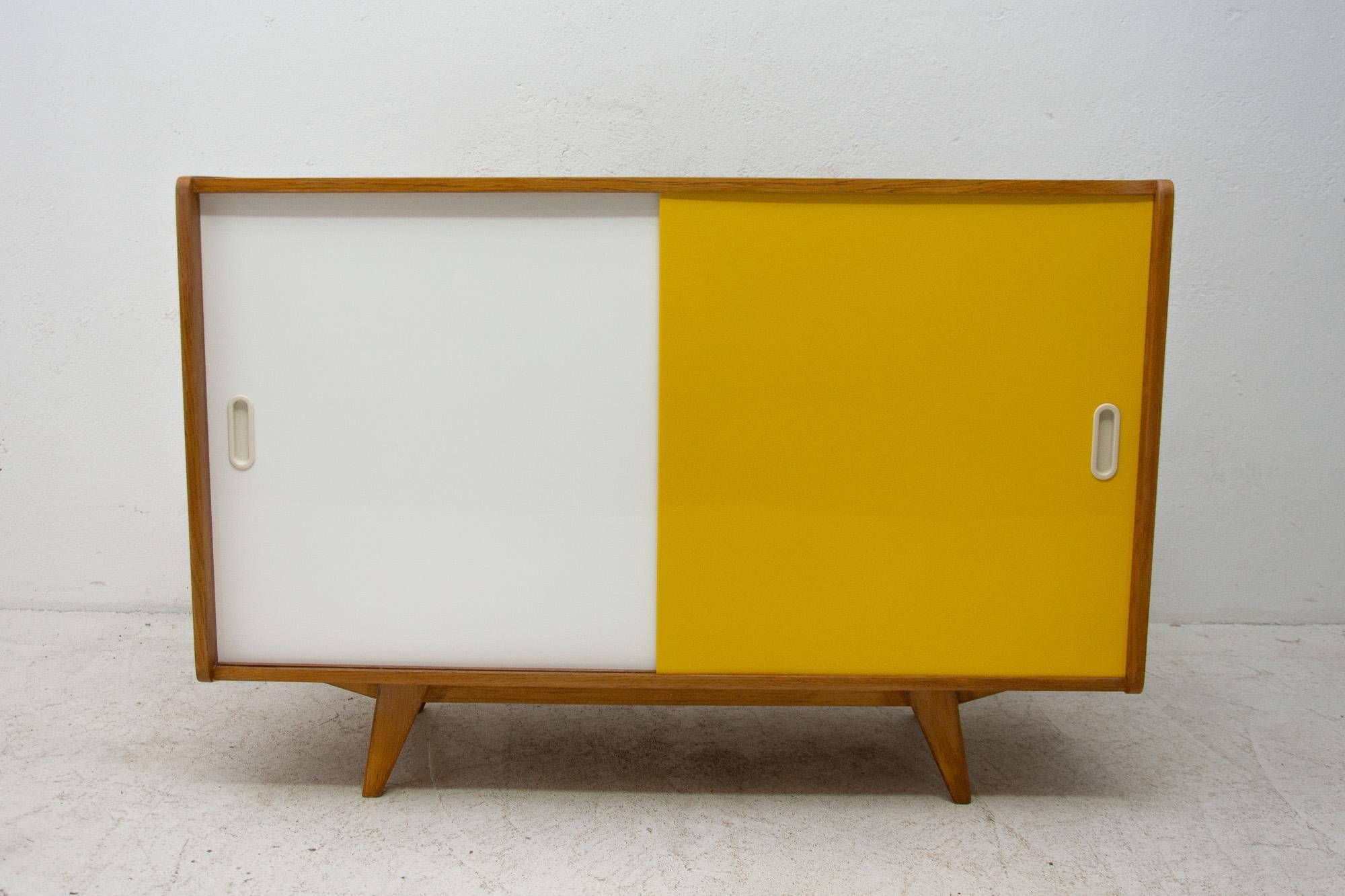 Midcentury sideboard-cabinet, catalogue No. U-450, designed by Jiri Jiroutek. It´s made of beechwood, veneer, plywood and laminate. In excellent condition, fully refurbished.

The cabinet comes from the famous Universal series (U-450), which was