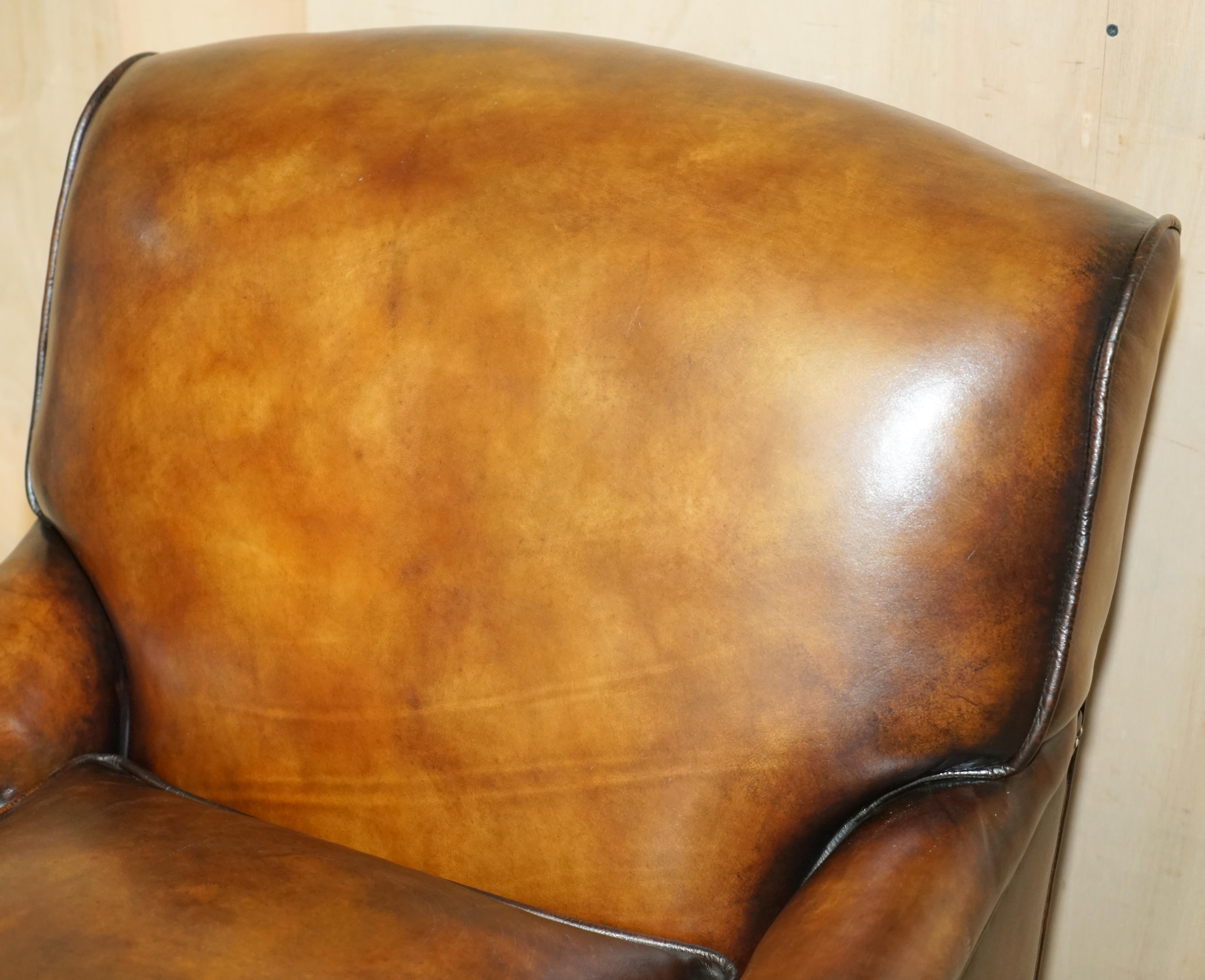 Hand-Crafted FULLY RESTORED PAIR OF ANTIQUE HOWARD & SON BRIDGEWATER BROWN LEATHER ARMCHAIRs For Sale