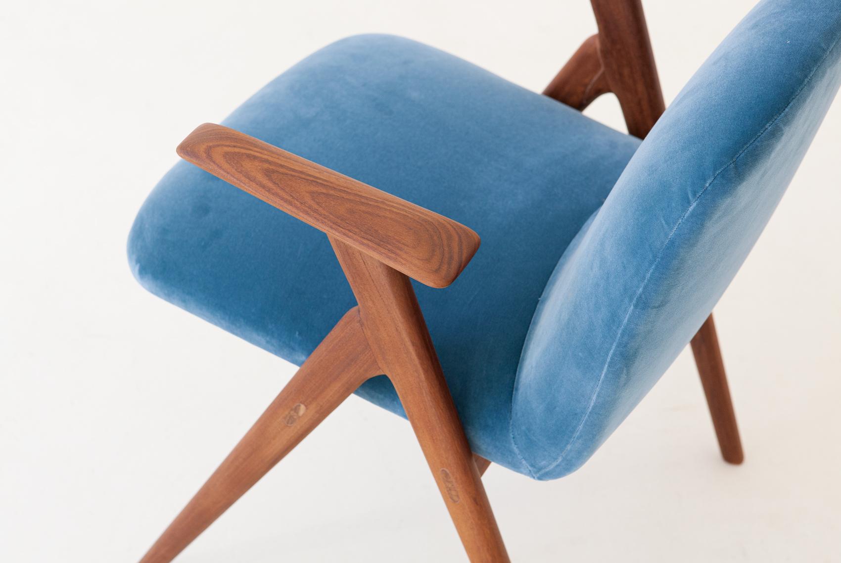 Italian Mid-Century Modern easy chairs in solid teak and light blue velvet upholstery.

Very light and smooth lines for this particular chair

Completely restored: the wooden frame has been polished and finished with little shellac, the cover is