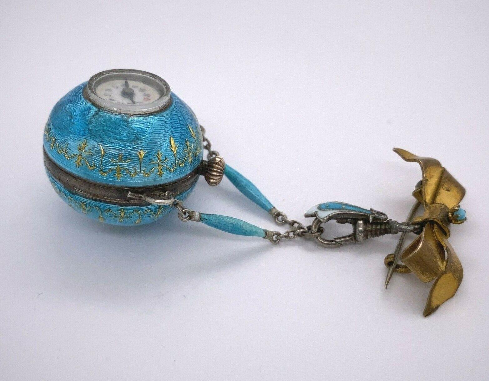 Ball Cut Fully Restored Turquoise Enamelled Ball Watch Suspended on a Bow Brooch For Sale