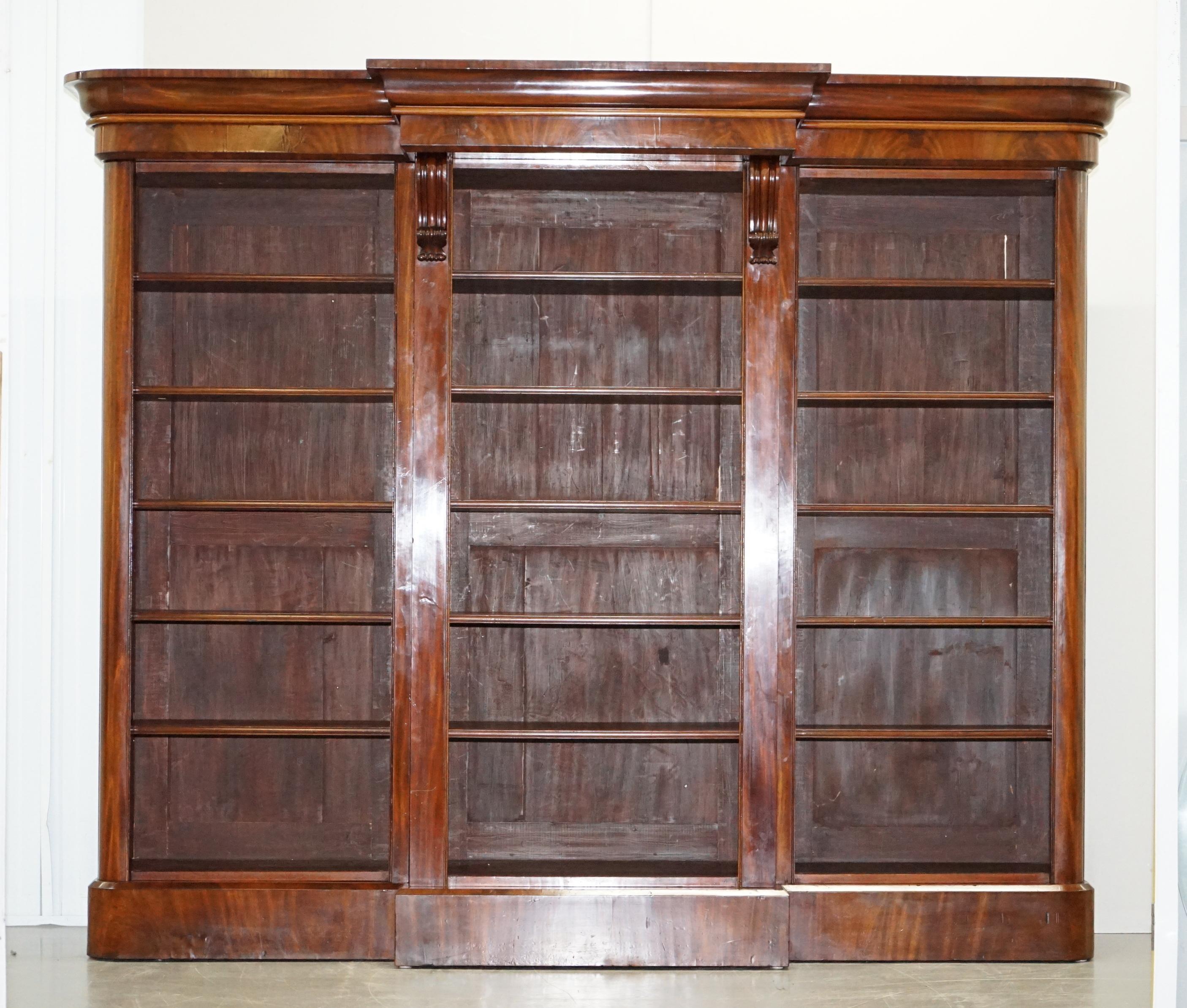 We are delighted to offer for sale this absolutely sublime fully restored mid Victorian circa 1860 flamed mahogany library breakfront bookcase 

A very well made and exceptionally decorative piece of mid Victorian Library furniture. The bookcase
