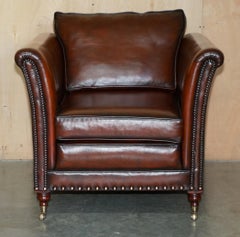 FULLY RESTORED VICTORIAN STYLE BROWN LEATHER ARMCHAIR WiTH ENGLISH BRASS CASTORS