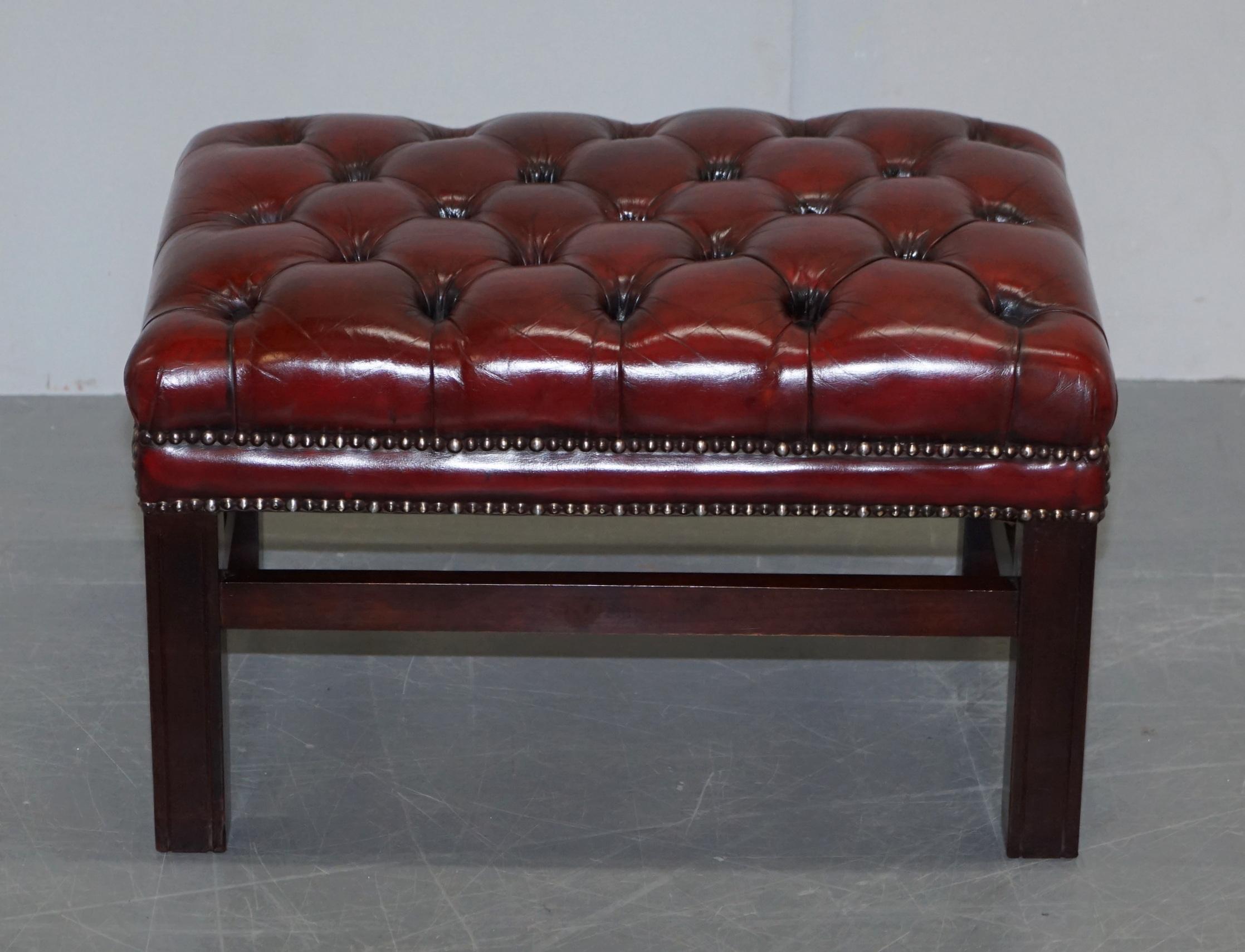 We are delighted to offer for sale this stunning fully restored hand dyed Cherry Bordeaux leather Chesterfield footstool

A very good looking and well made piece, it has been upholstered with high grade leather which has been hand dyed this nice