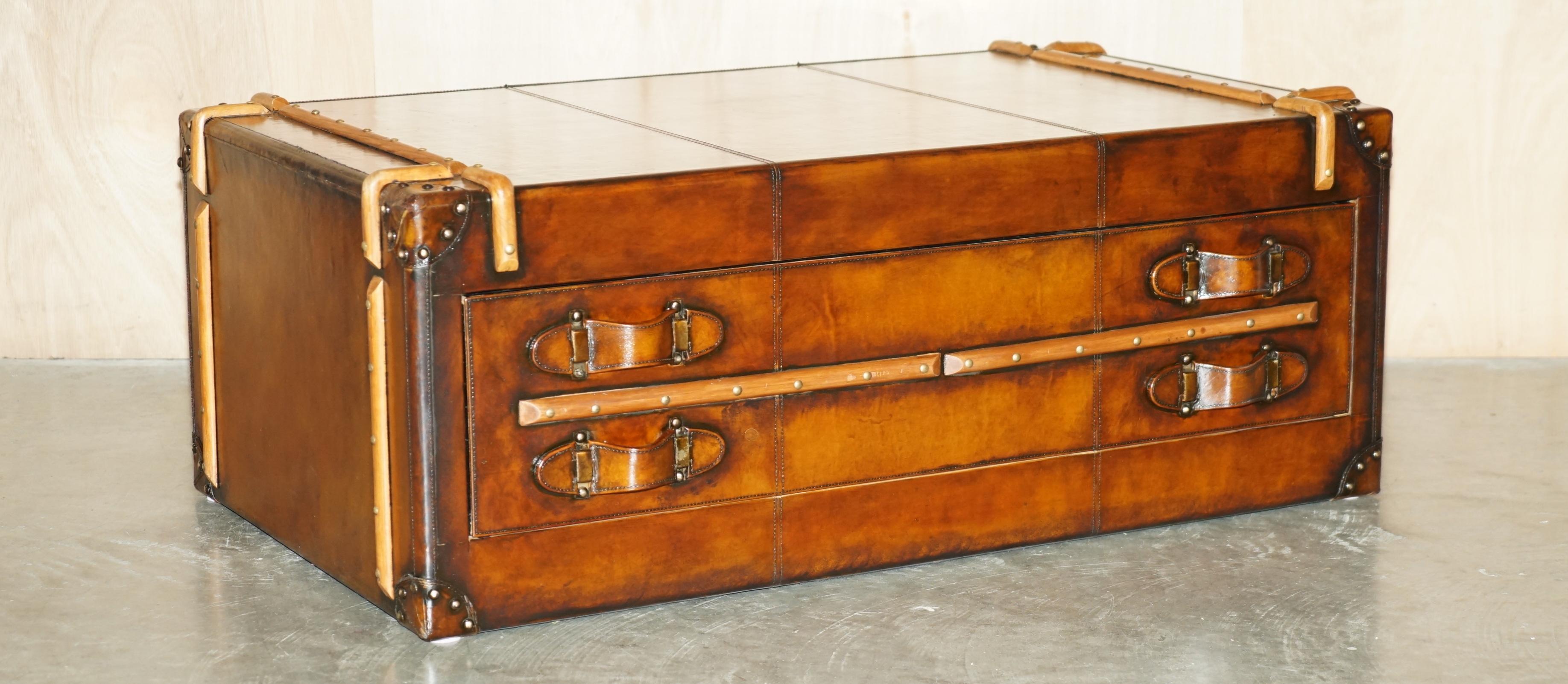 Royal House Antiques

Royal House Antiques is delighted to offer for sale this highly decorative, fully restored, hand dyed cigar brown leather steamer trunk coffee table with one large single drawer ideally suited to a coffee table or tv stand