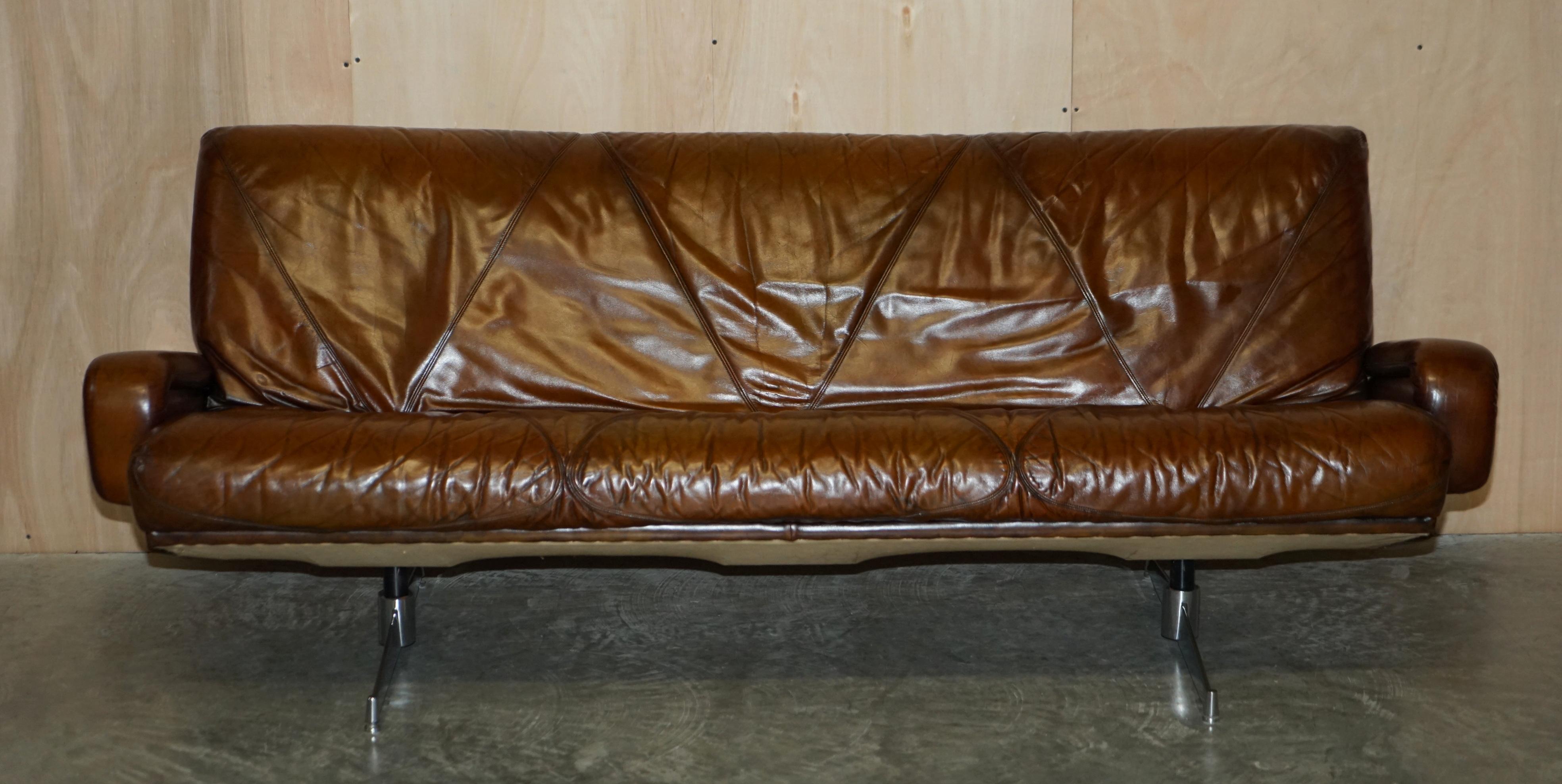 We are delighted to offer for sale this absolutely stunning, hand dyed whisky brown leather, mid century modern sofa which chrome legs.

A very well made, decorative and extremely comfortable sofa. This is one of the most stylish pieces we have