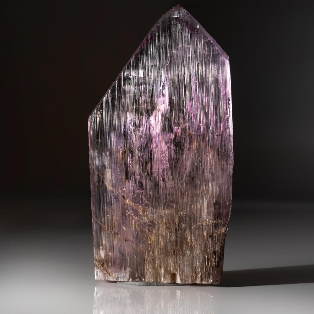 Fully terminated transparent gem quality spodumene var. kunzite with intense vibrant pink color all throughout the crystals. The crystal faces are deeply striated with a glassy luster. Vibrant pink color at its c-axis. Damage free,

Kunzite is a