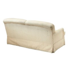 Fully Upholstered and Skirted Cream Loveseat