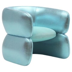 Fully Upholstered Lounge Features a Sleek Hourglass Silhouette and Plush Seat