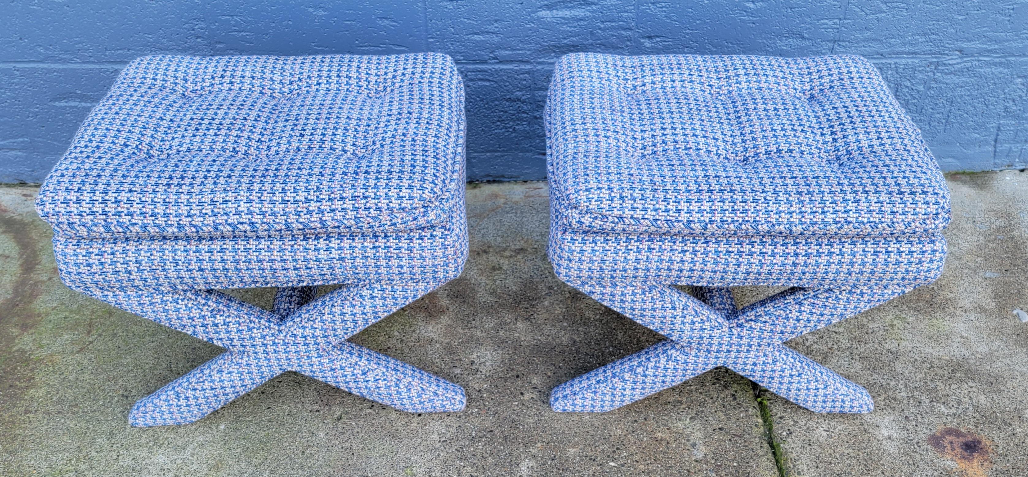 A pair of X base upholstered stools or ottomans. Herringbone fabric, fully upholstered. In very good original condition. Late 20th century.