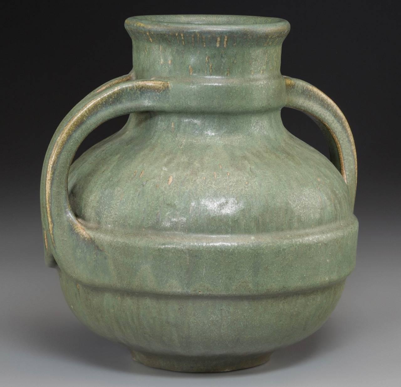 An early and fine Fulper pottery Arts & Crafts green hammered ceramic two-handled vase. Very fat and heavy.

Measures: Height 8.8 inches (22.2 cm)
Width 9 inches (22.5 cm)

Marked: FULPER

Condition: Excellent with wear commensurate of age