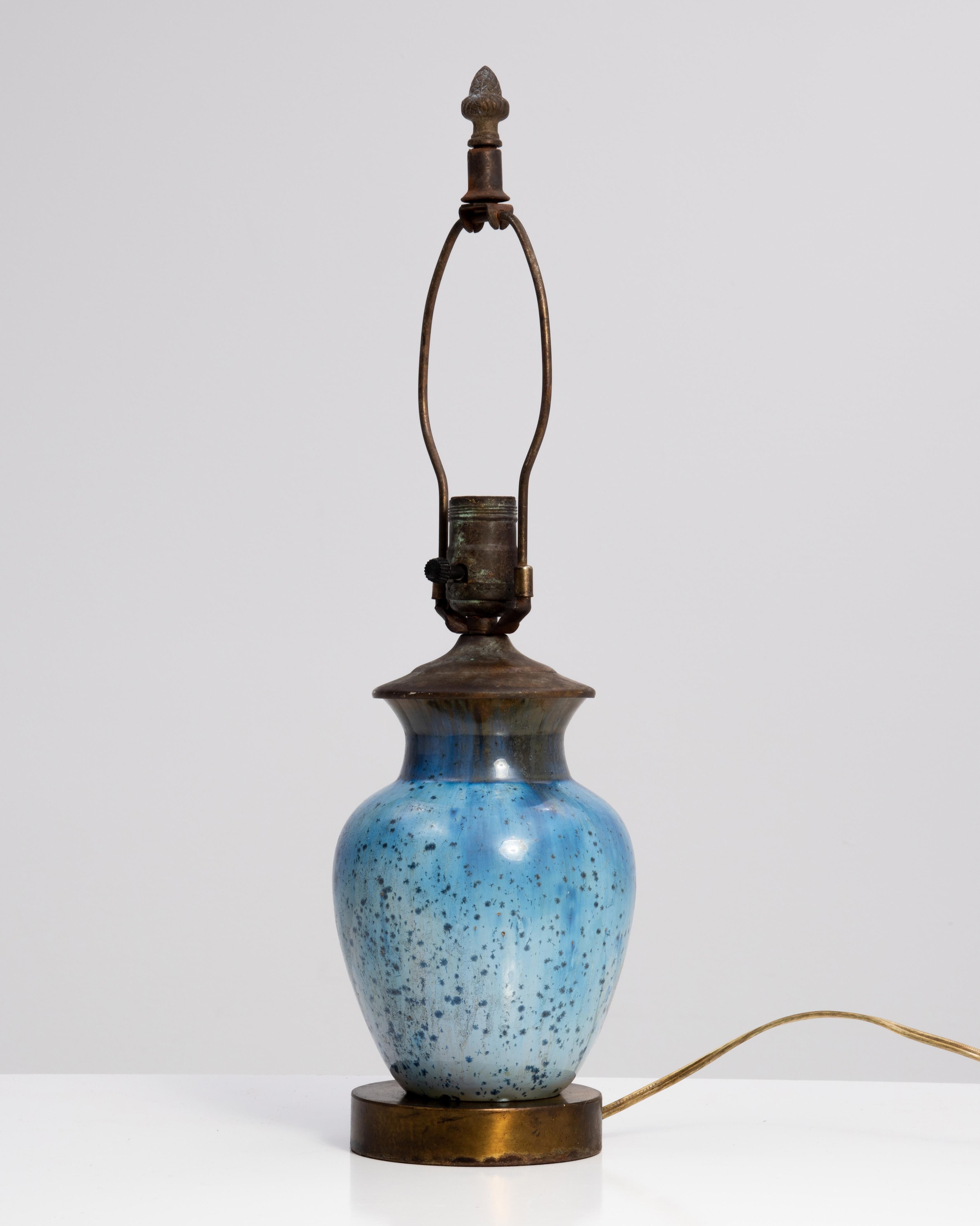 An American Arts & Crafts classic, a Fulper Pottery lamp in a blue crystalline glaze. To confirm the lamp is Fulper we separated the base from the body and it revealed the oval incised mark ca. 1917-1927. It is 12”. to the top of the socket. All