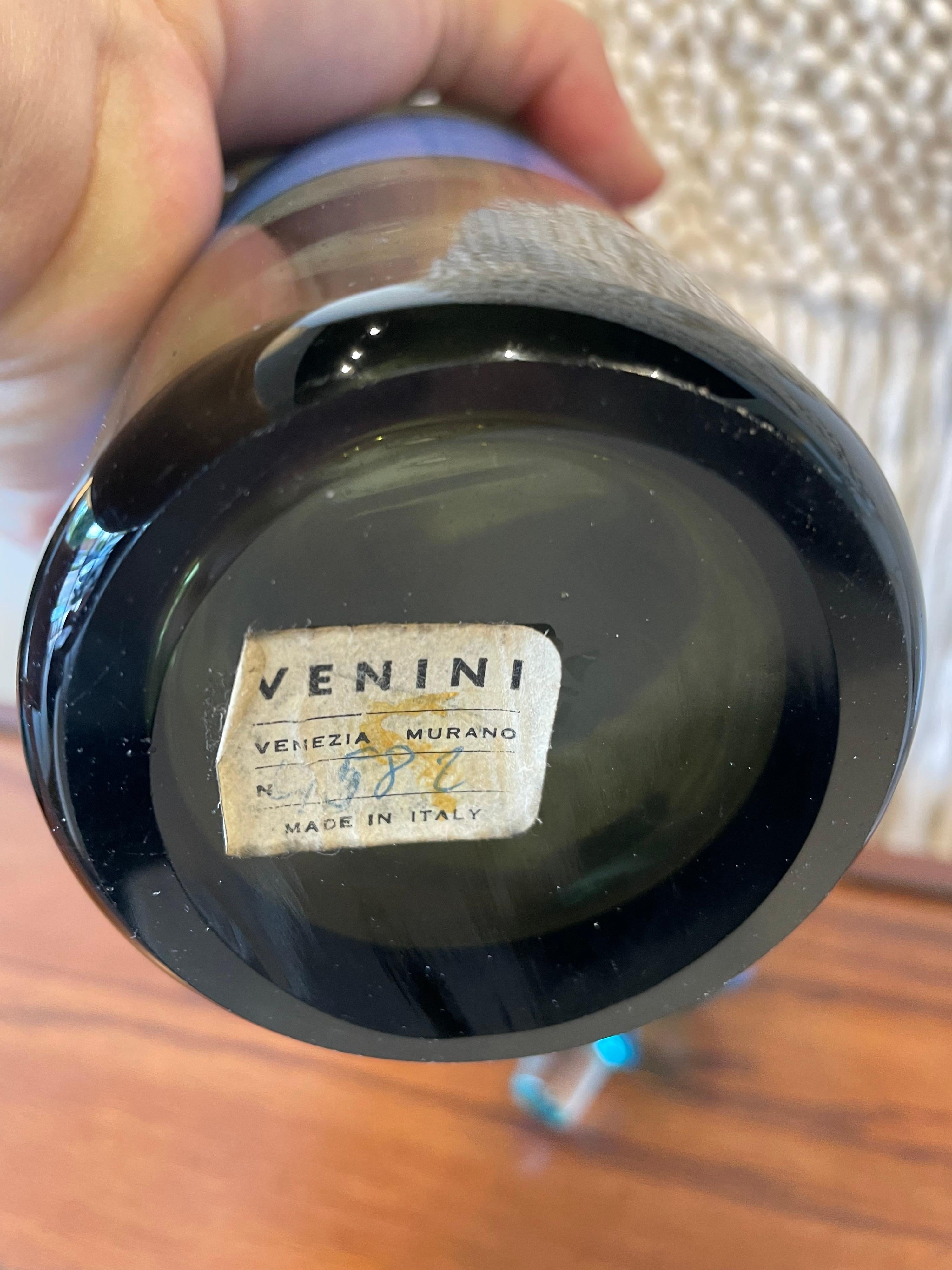 Extremely rare large blue striped hand blown Murano glass bottle and stopper. Decorated with two hot applied vivid blue bands. Listed in the Venini archives under the reference 4315, the model was designed in 1950, the year in which it was exhibited