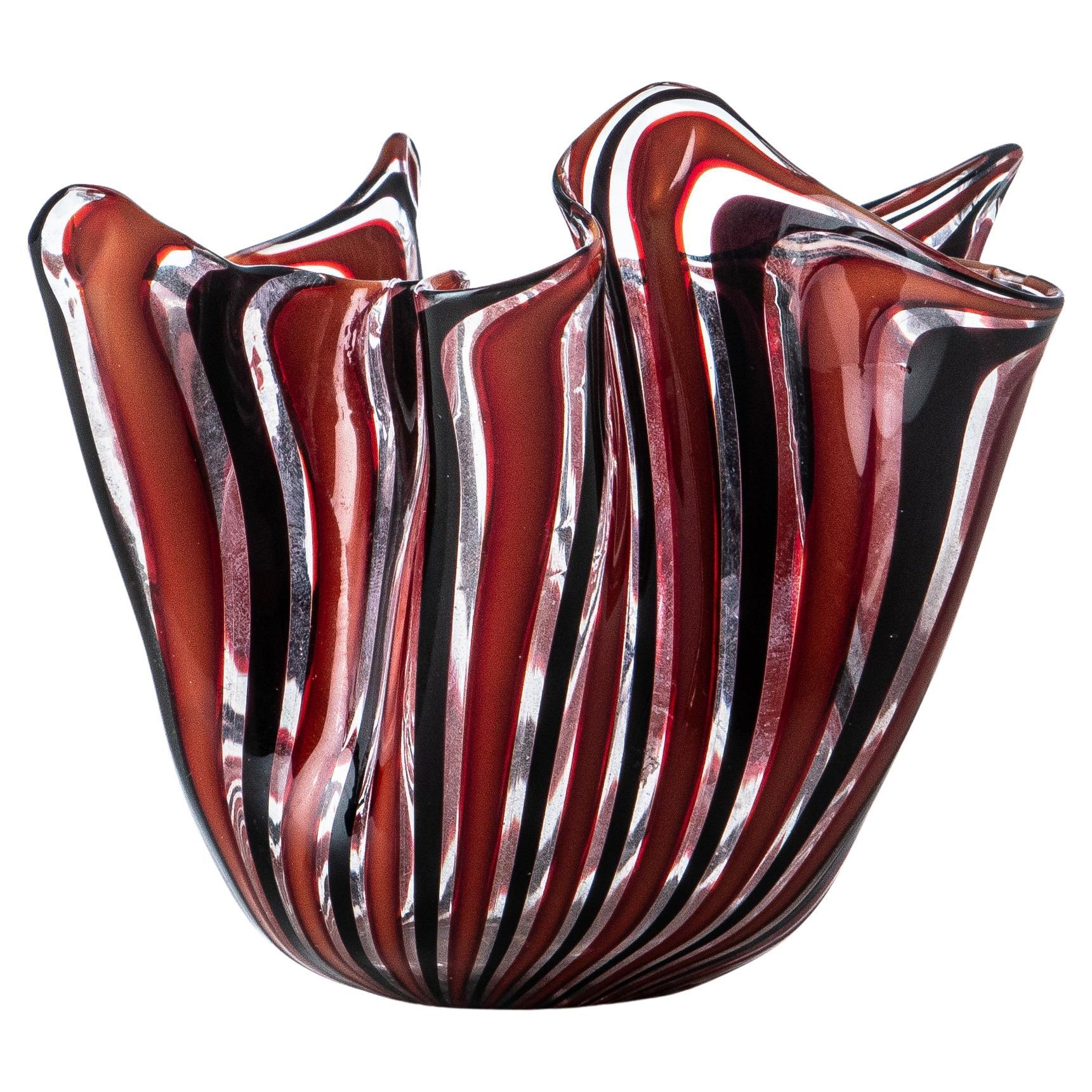 A vintage Murano hand blown 'fazzoletto'/handkerchief  art glass vase. Deigned by Fulvio Bianconi, for the Venini Company, circa 1950, the vase has a red and white decoration of alternating intersecting stripes, creating an original pattern specific