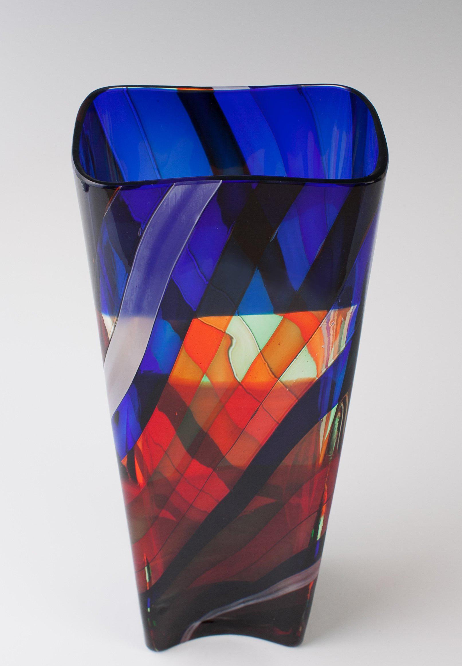 Fulvio Bianconi. 'Scozzese' vase, circa 1954. H. 26.5 cm. Made by Venini & C. clear glass with fused ribbons, green, blue, red and opaque white and red. Marked: venini murano ITALY (round acid stamp).
Acid signed, three-lines 