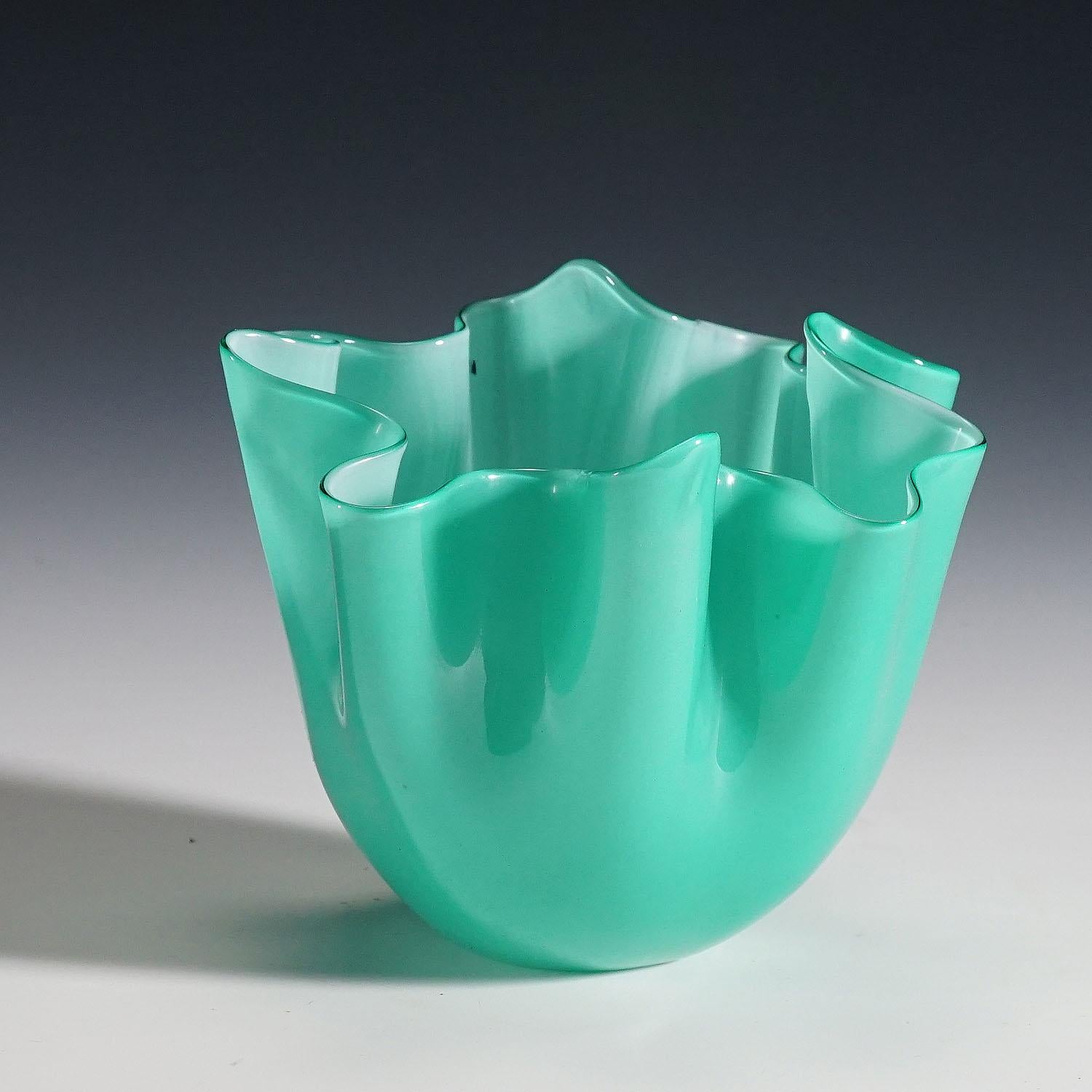 A small fazzoletto vase in lattimo and green glass designed by Fulvio Bianconi in 1950, manufactured by Venini, Venice, circa 1960. Acid stamped signature 'Venini Murano italia' on the base. Model no. 3927.
Lit.:
marino barovier with carla sonego,