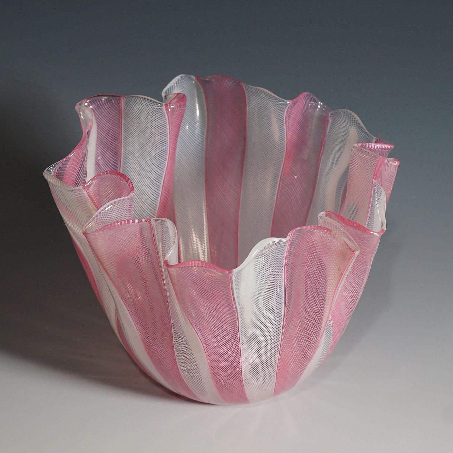 A Fazzoletto vase in white and pink Zanfirico glass designed by Fulvio Bianconi in 1950, manufactured by venini, venice. Acid etched signature 'venini murano italia' on the base. A tiny black inclusion on the rim. model no. 4217.

Lit.:
marino