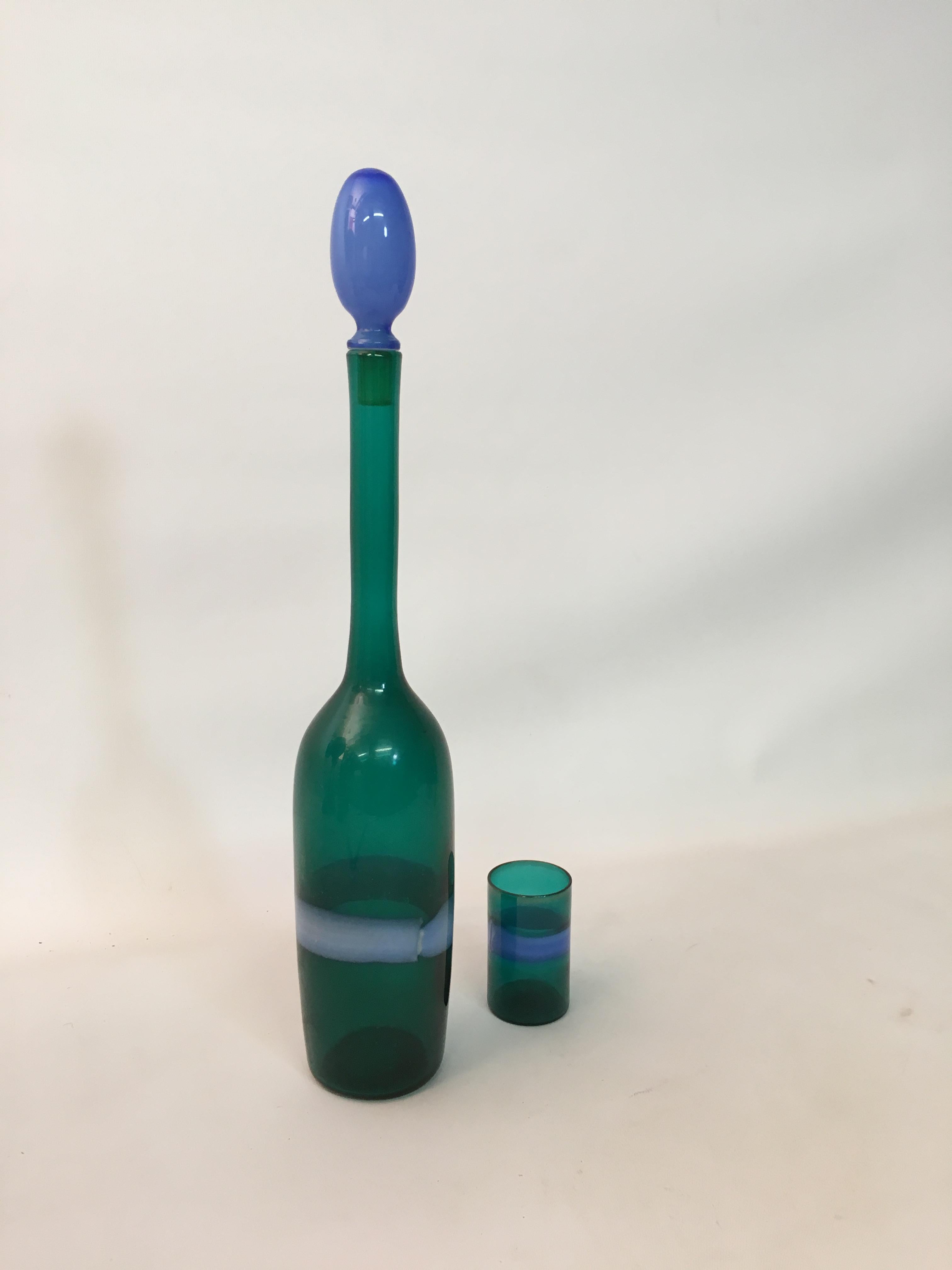 Elegant Italian design by master glassblower, Fulvio Bianconi for Venini, circa 1955. Incalmo glass decanter bottle with a small cordial glass. Both pieces are signed with Venini paper labels. The stopper is an azure blue and the bottle body is a
