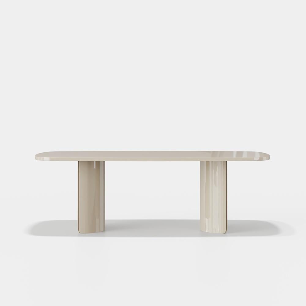 A harmonious blend of natural richness and contemporary refinement, this dining table features a fumed eucalyptus top, celebrated for its deep, smoky tones and distinctive grain pattern. The surface exudes a tactile warmth, offering a sophisticated