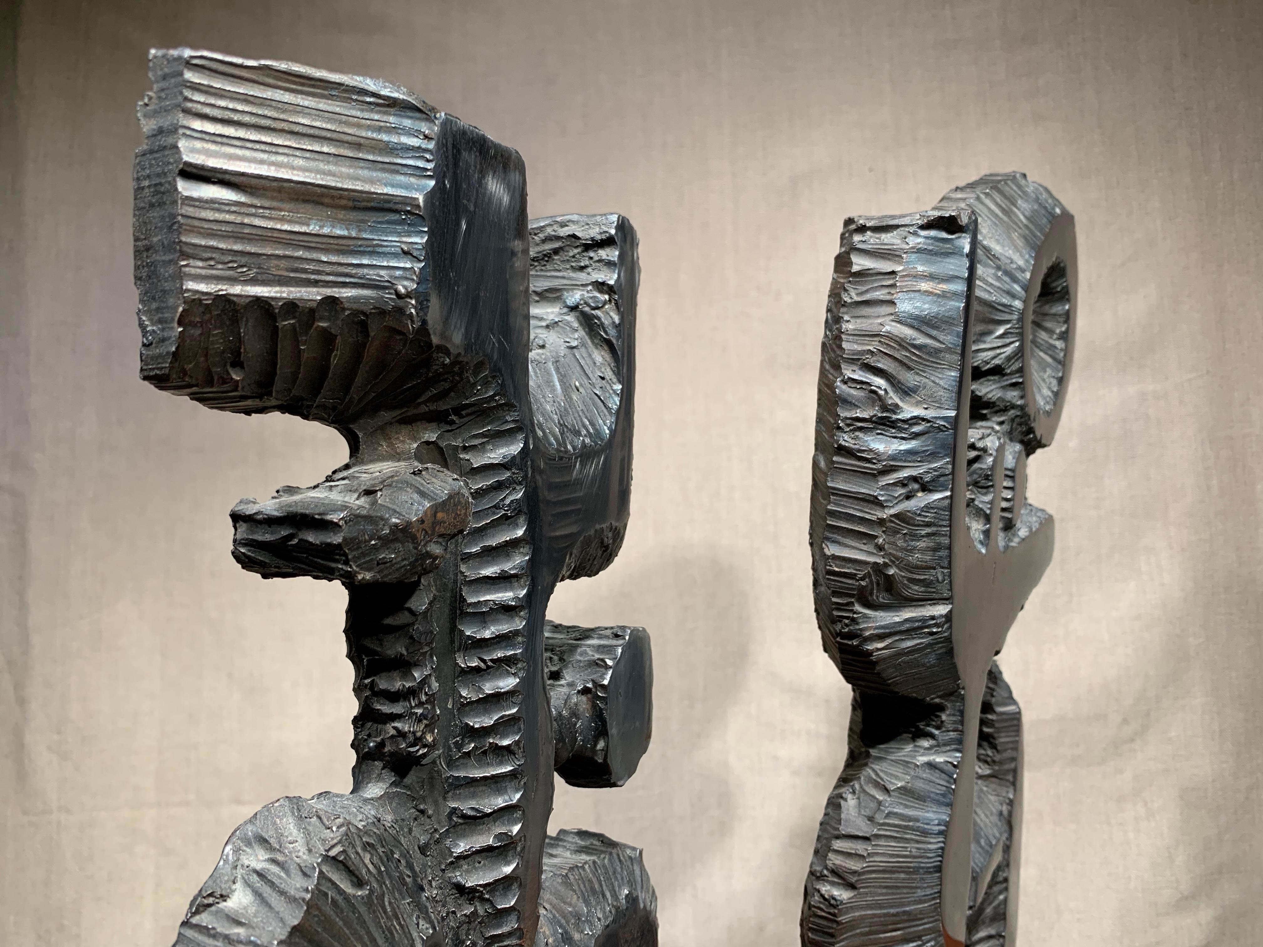 Fumio Otani (Japanese, 1929-1995). Untitled and Untitled, ca, 1965. Cast and polished steel. 

Smaller composition measures 14.75 x 7.75 x 1.5 inches.

Larger composition measures 16.75 x 11 x 1.5 inches.

Wood block base measures  3 inches (h); 6