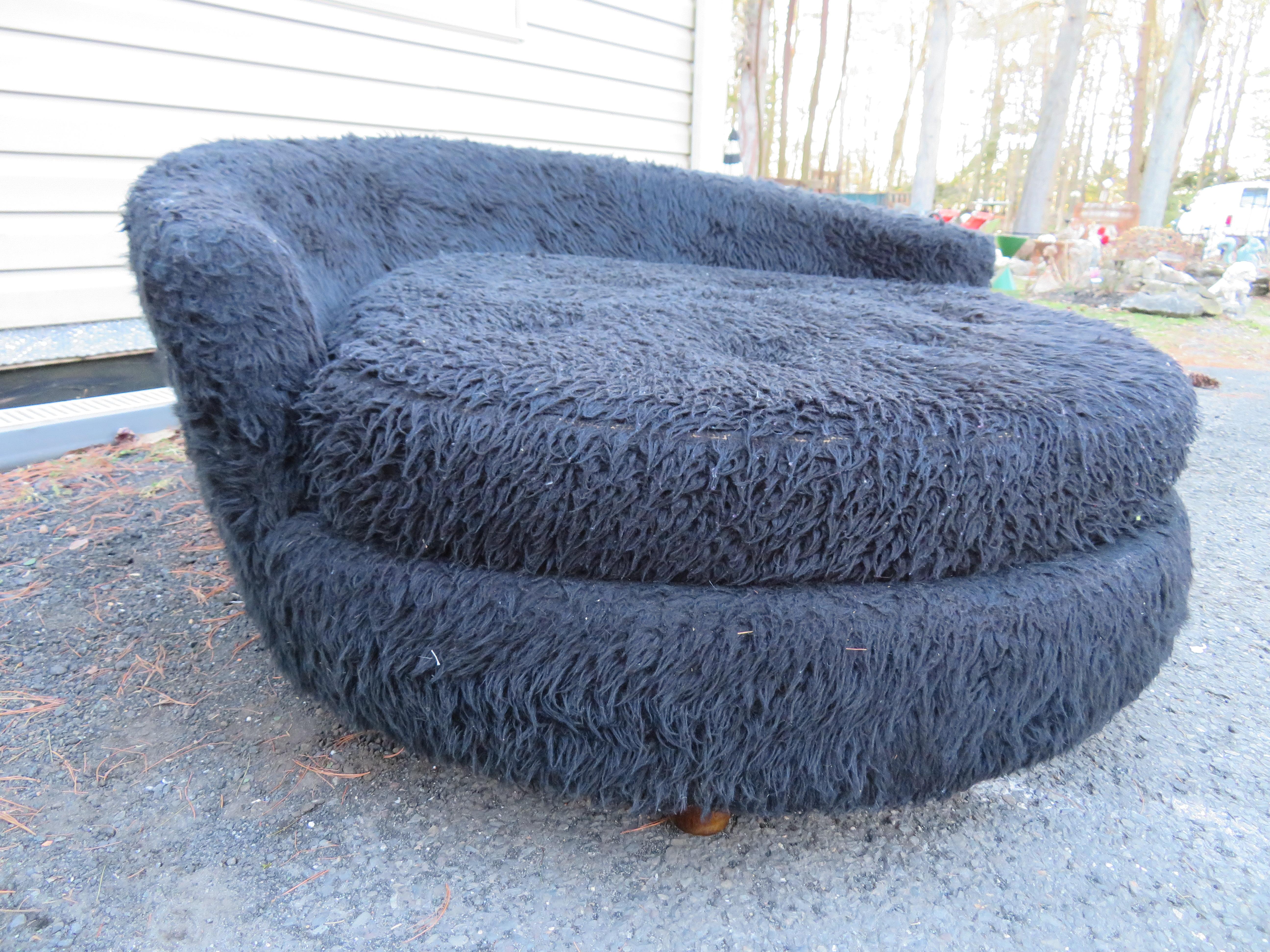 Fun Adrian Pearsall circular chaise lounge chair. This fuzzy chair retains its original grizzly bear fun fur and will need to be reupholstered. It measures 24