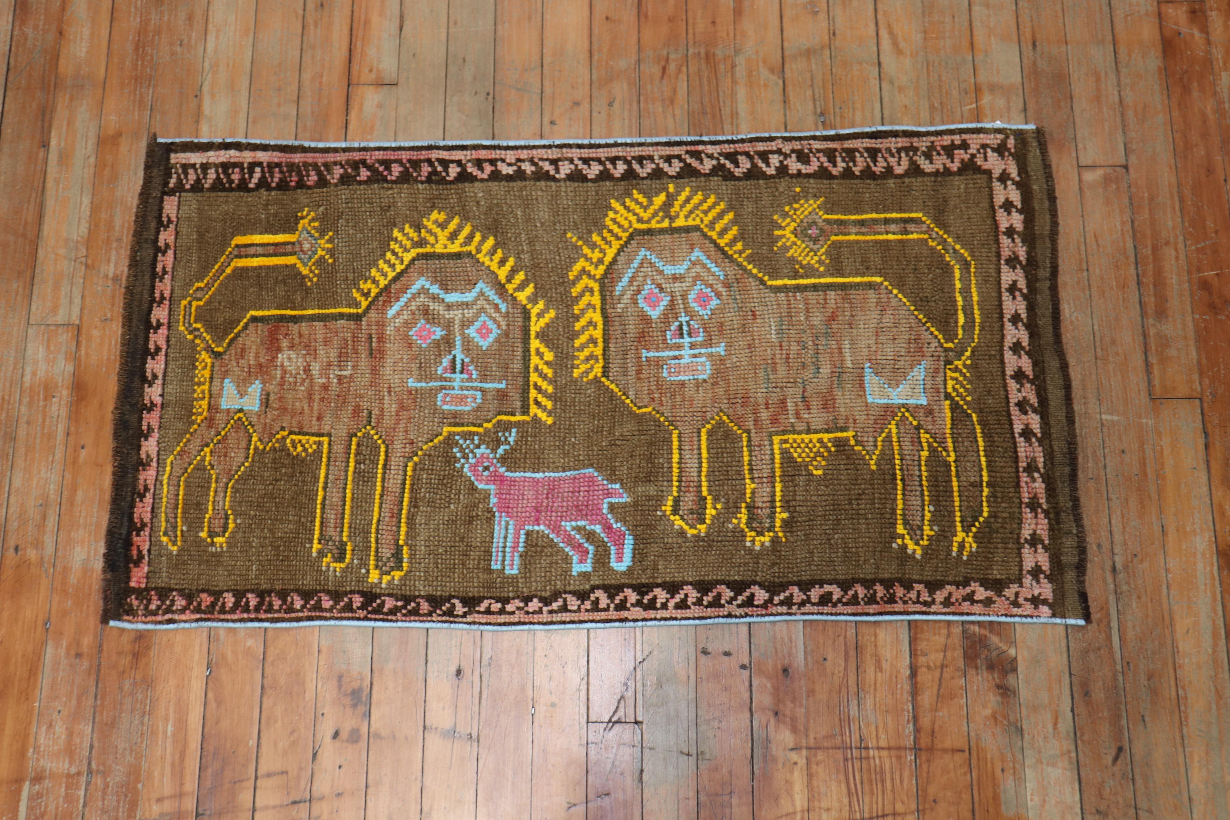 A late 20th century Turkish rug depicting 2 lions outlined in yellow and a pink sheep outlined in light blue on a brown field.
they all seem pretty happy, right? dated 1980

Measures: 1'10